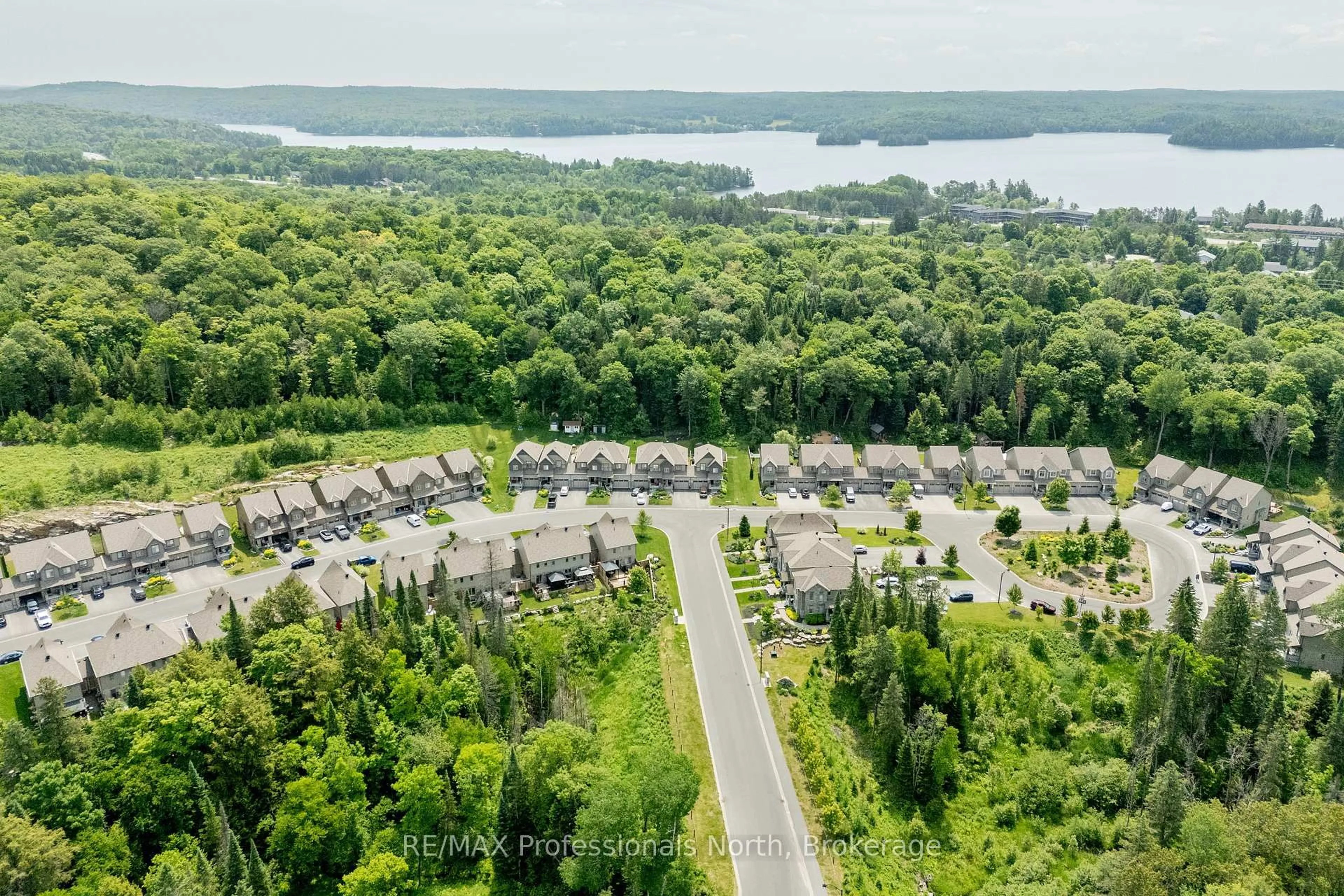 A pic from outside/outdoor area/front of a property/back of a property/a pic from drone, water/lake/river/ocean view for 3 Kelsey Madison Crt, Huntsville Ontario P1H 0E2