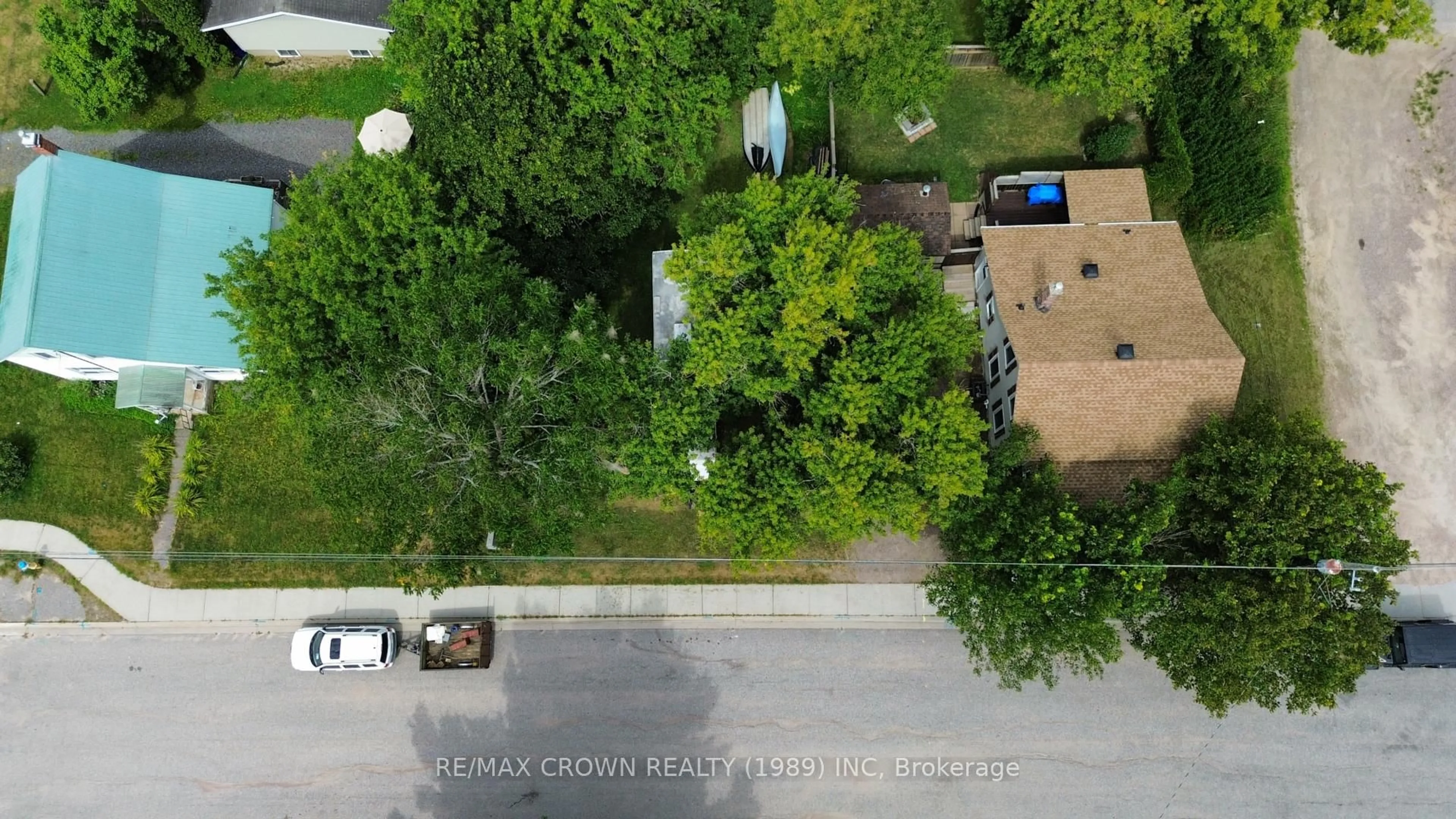 A pic from outside/outdoor area/front of a property/back of a property/a pic from drone, street for 62 Memorial Park Dr, Powassan Ontario P0H 1Z0