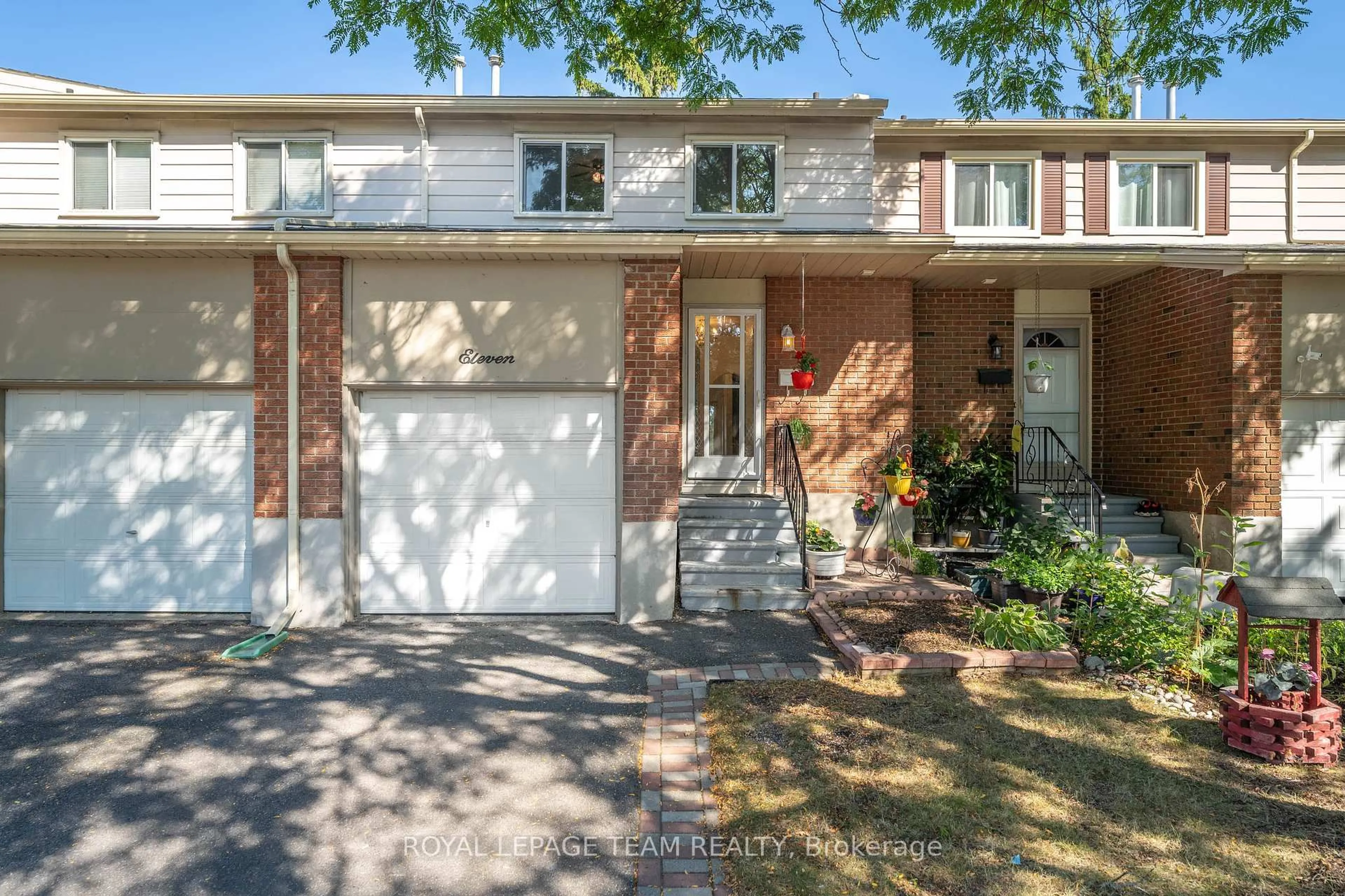Home with brick exterior material, street for 2415 SOUTHVALE Cres #11, Ottawa Ontario K1B 4T9