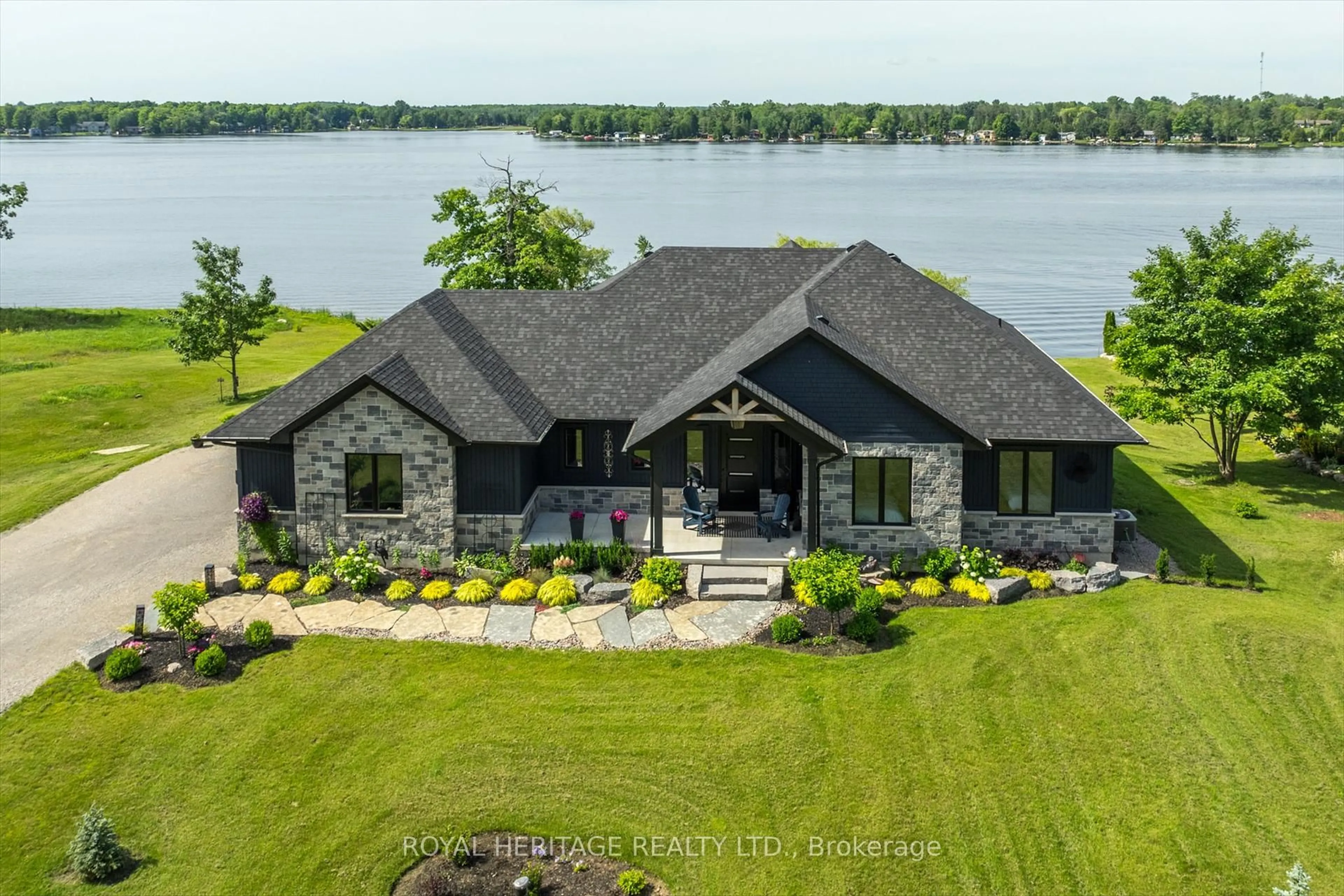 A pic from outside/outdoor area/front of a property/back of a property/a pic from drone, water/lake/river/ocean view for 74 Fire Route 70 Rte, Trent Lakes Ontario K0L 1J0