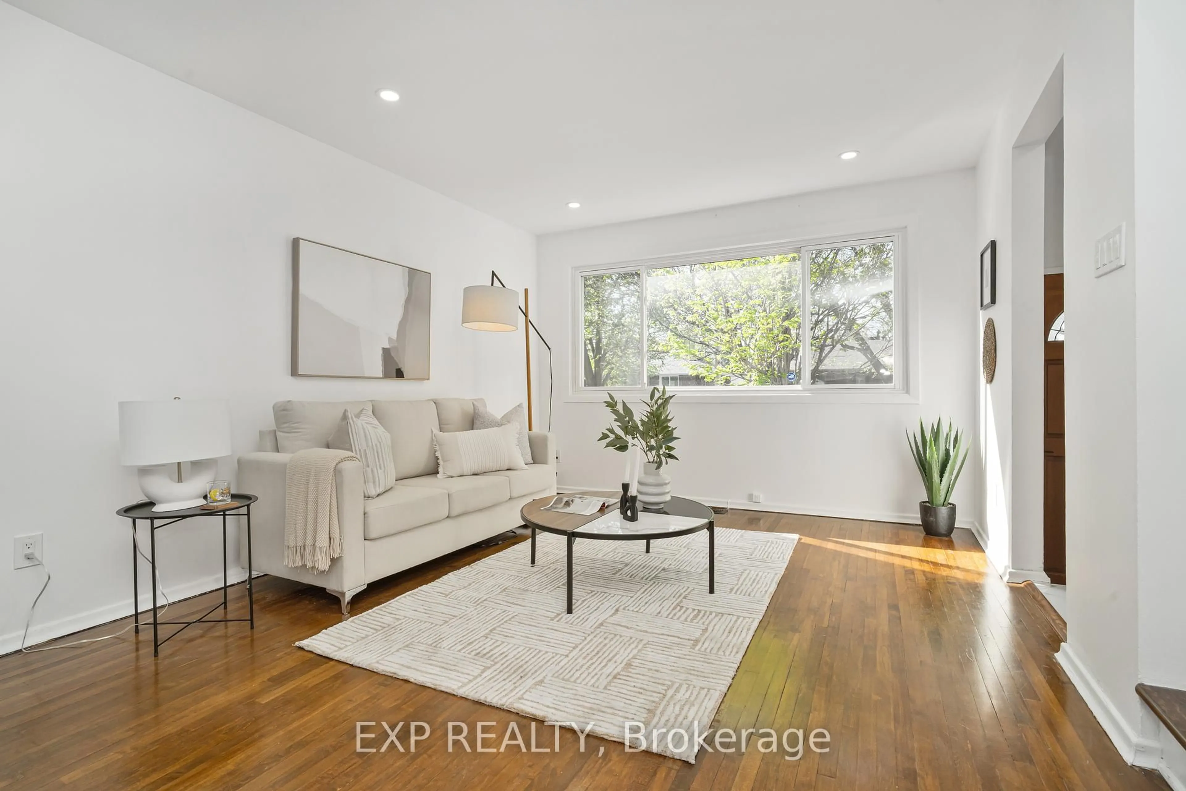Living room with furniture, wood/laminate floor for 1510 Lepage Ave, Ottawa Ontario K1Z 8C9