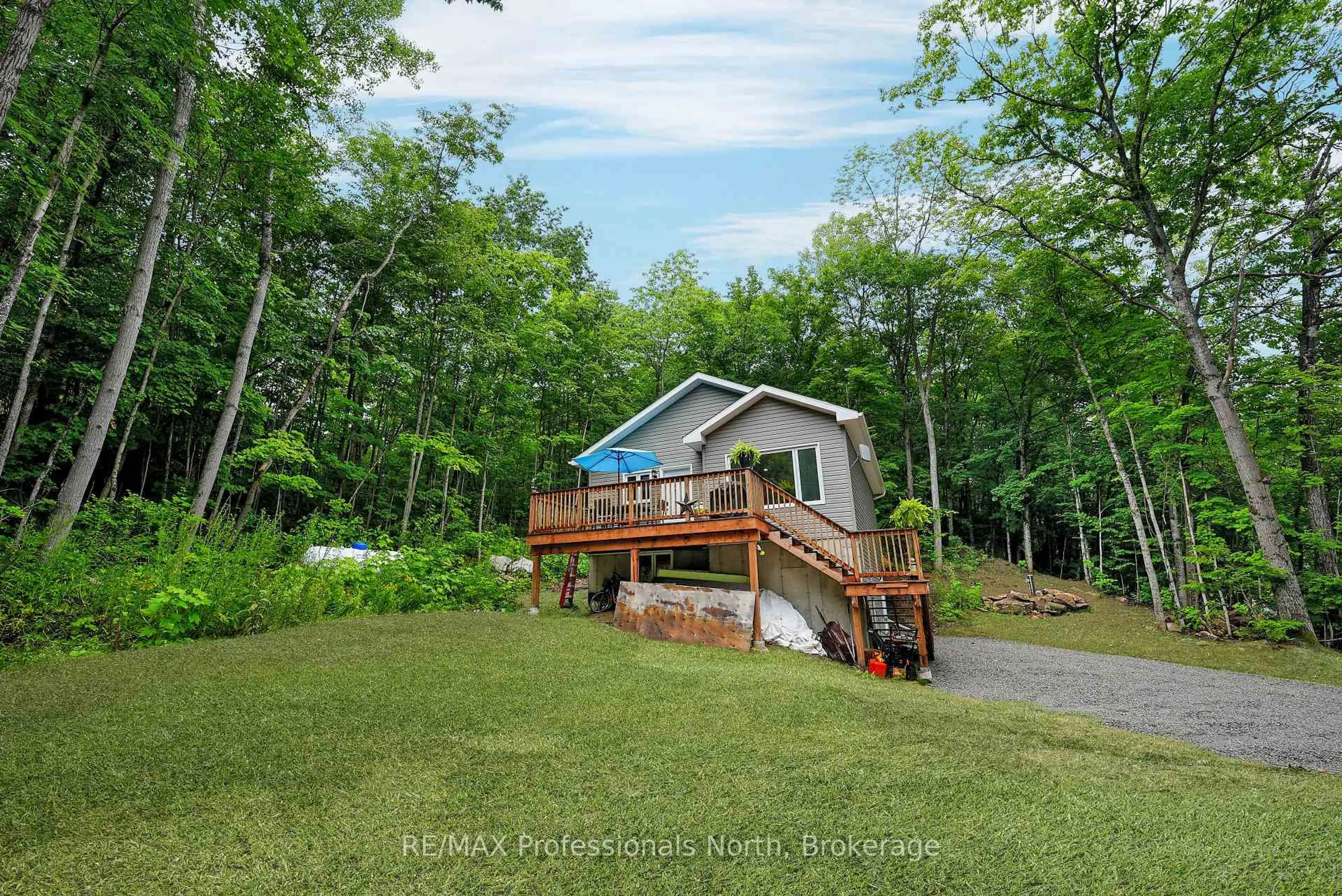 A pic from outside/outdoor area/front of a property/back of a property/a pic from drone, water/lake/river/ocean view for 1065 Hendersons Rd, Minden Hills Ontario K0M 2K0