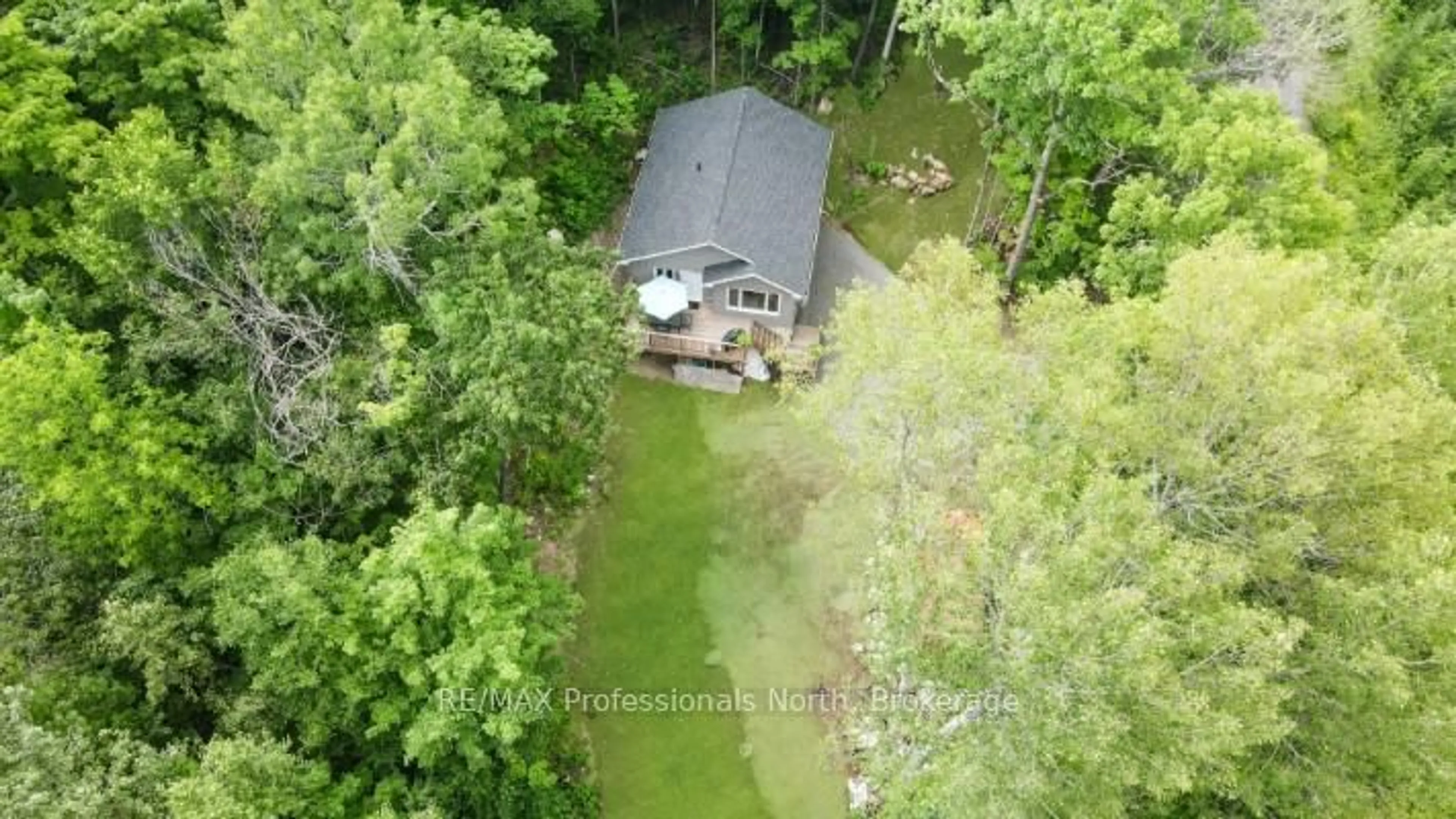 A pic from outside/outdoor area/front of a property/back of a property/a pic from drone, forest/trees view for 1065 Hendersons Rd, Minden Hills Ontario K0M 2K0