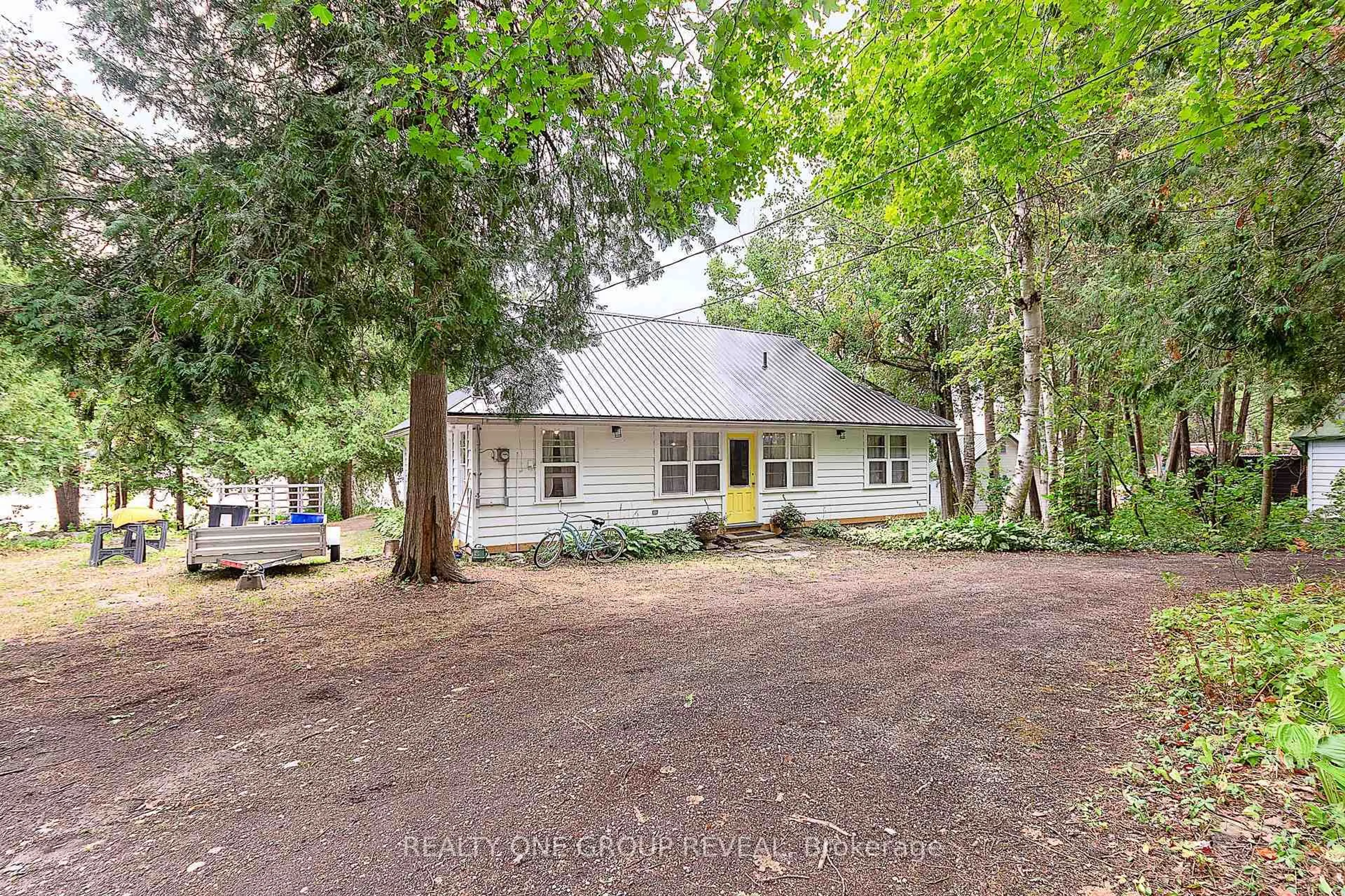 A pic from outside/outdoor area/front of a property/back of a property/a pic from drone, street for 26 Fire Route 128, Trent Lakes Ontario K0M 1A0
