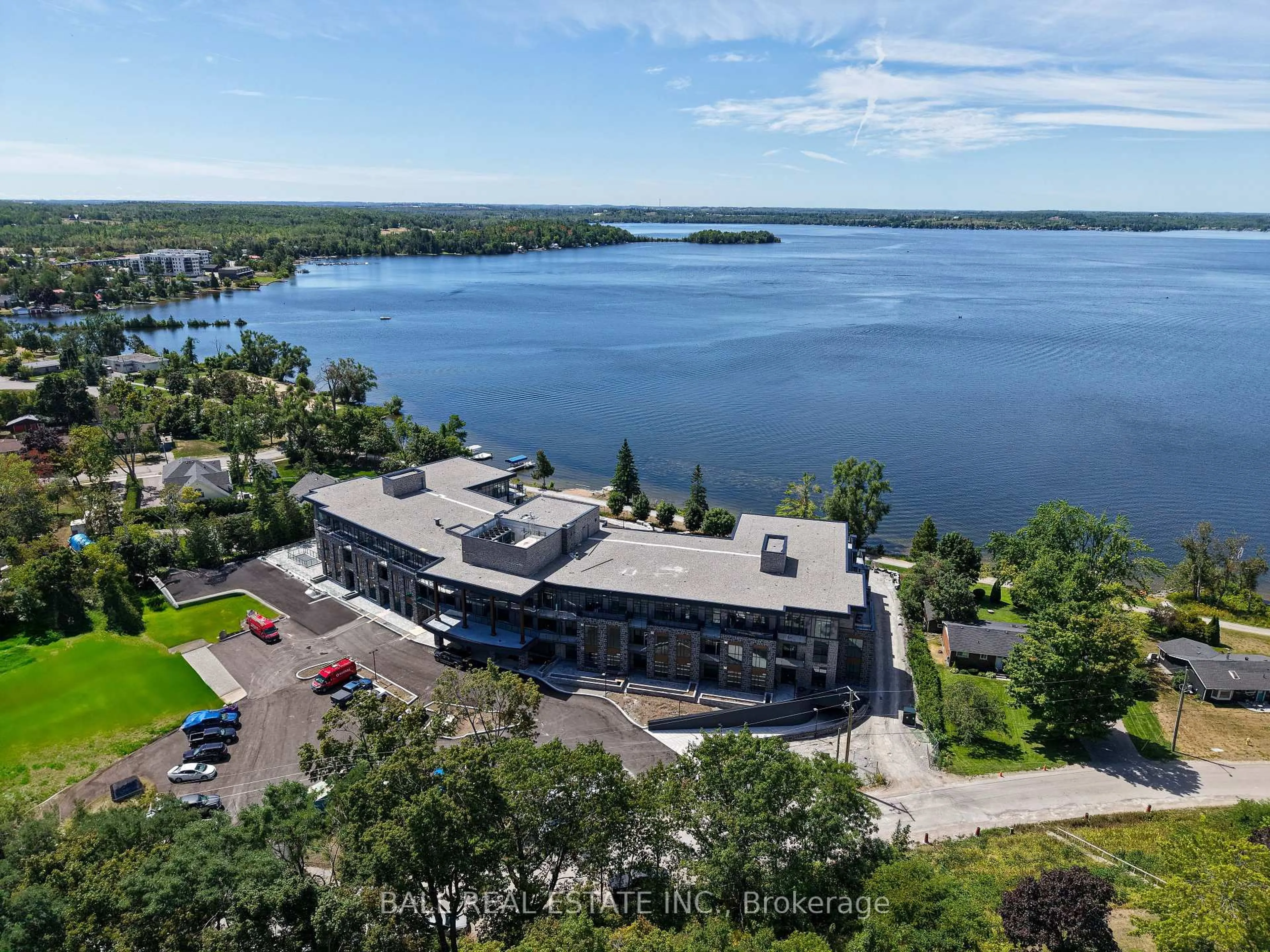A pic from outside/outdoor area/front of a property/back of a property/a pic from drone, water/lake/river/ocean view for 99 Louisa St #108, Kawartha Lakes Ontario K0M 1N0
