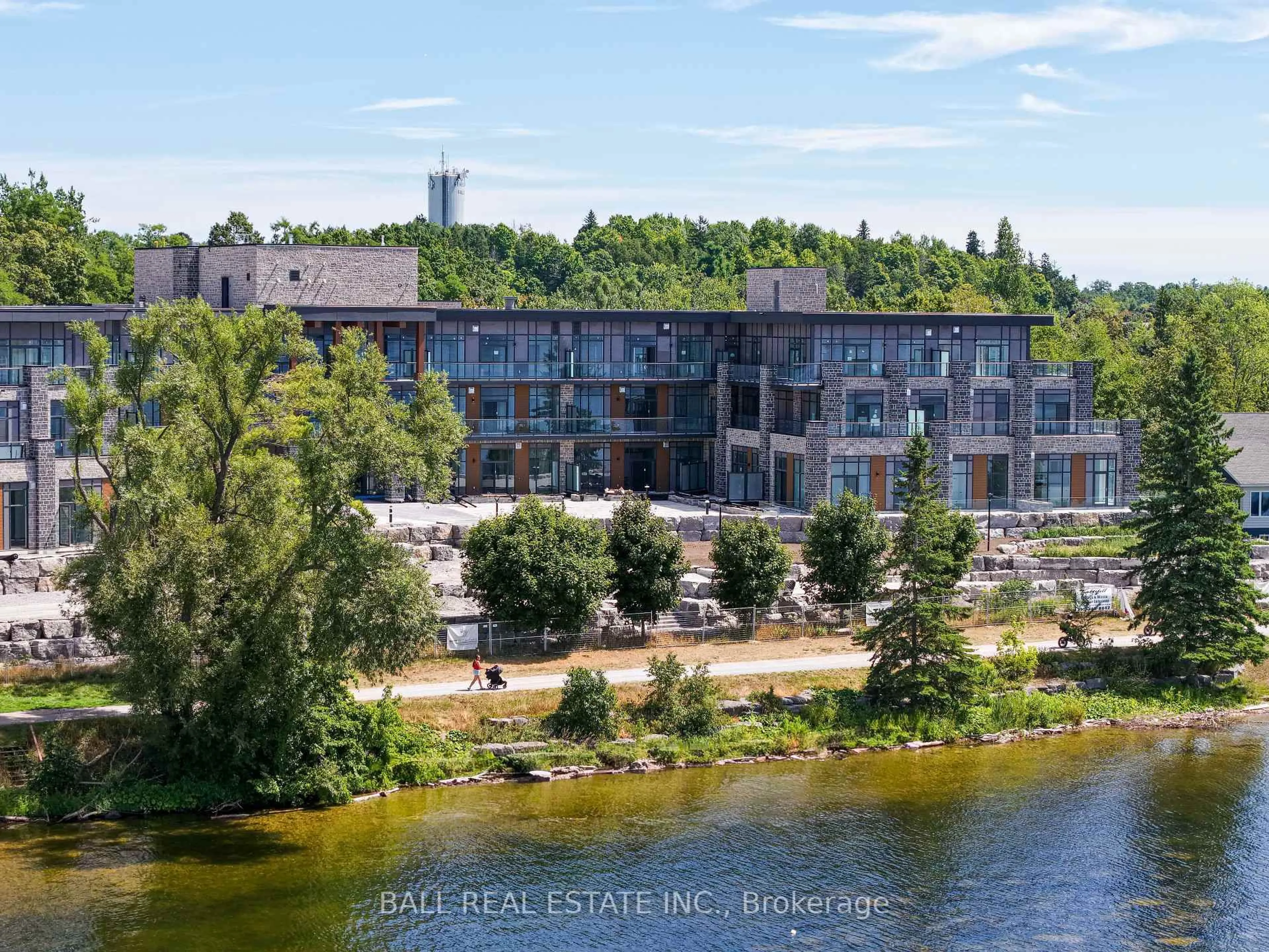 A pic from outside/outdoor area/front of a property/back of a property/a pic from drone, water/lake/river/ocean view for 99 Louisa St #108, Kawartha Lakes Ontario K0M 1N0