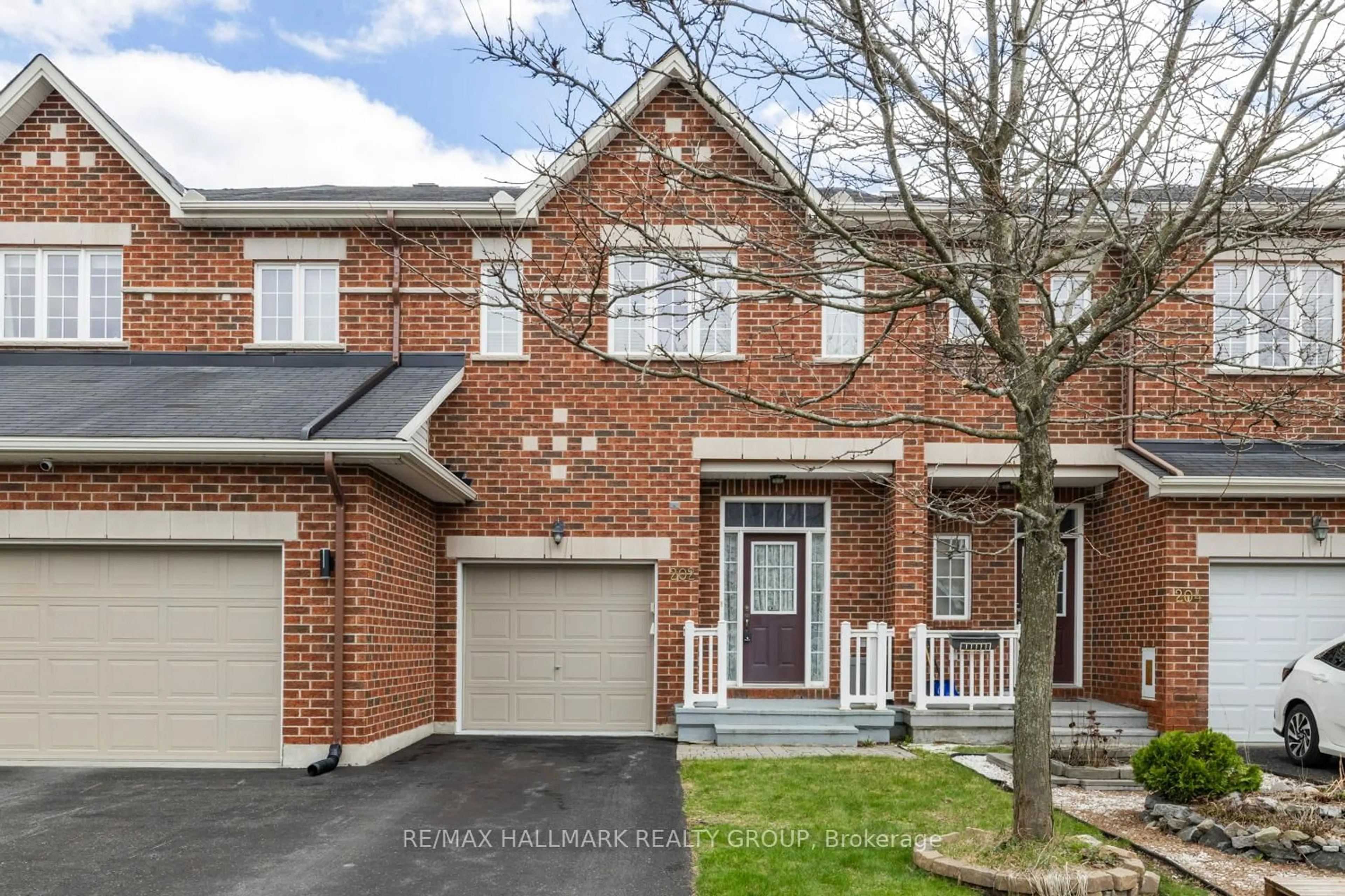 Home with brick exterior material, street for 202 Waymark Cres, Ottawa Ontario K2M 0A6