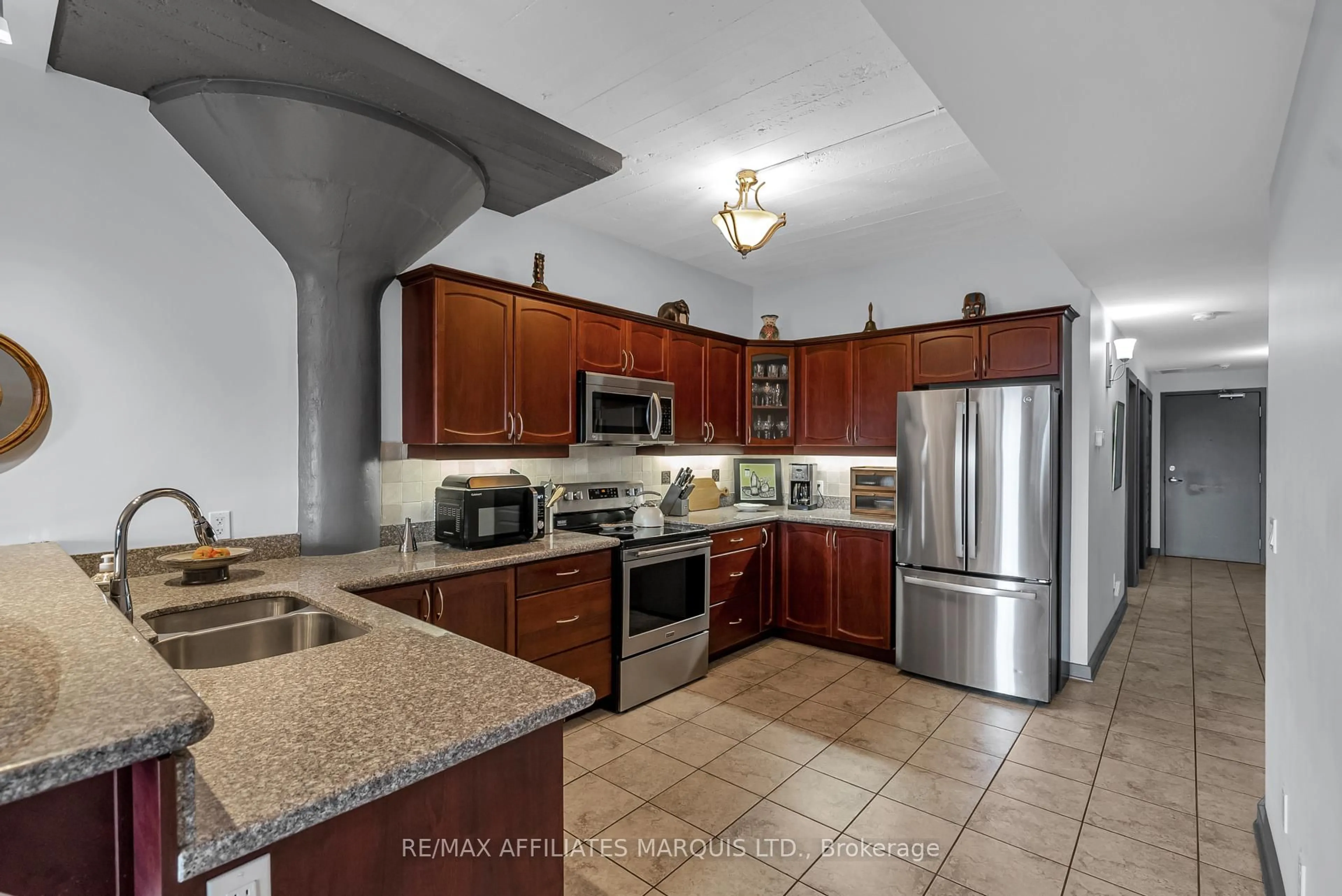 Open concept kitchen, ceramic/tile floor for 710 Cotton Mill St #405, Cornwall Ontario K6H 7L3
