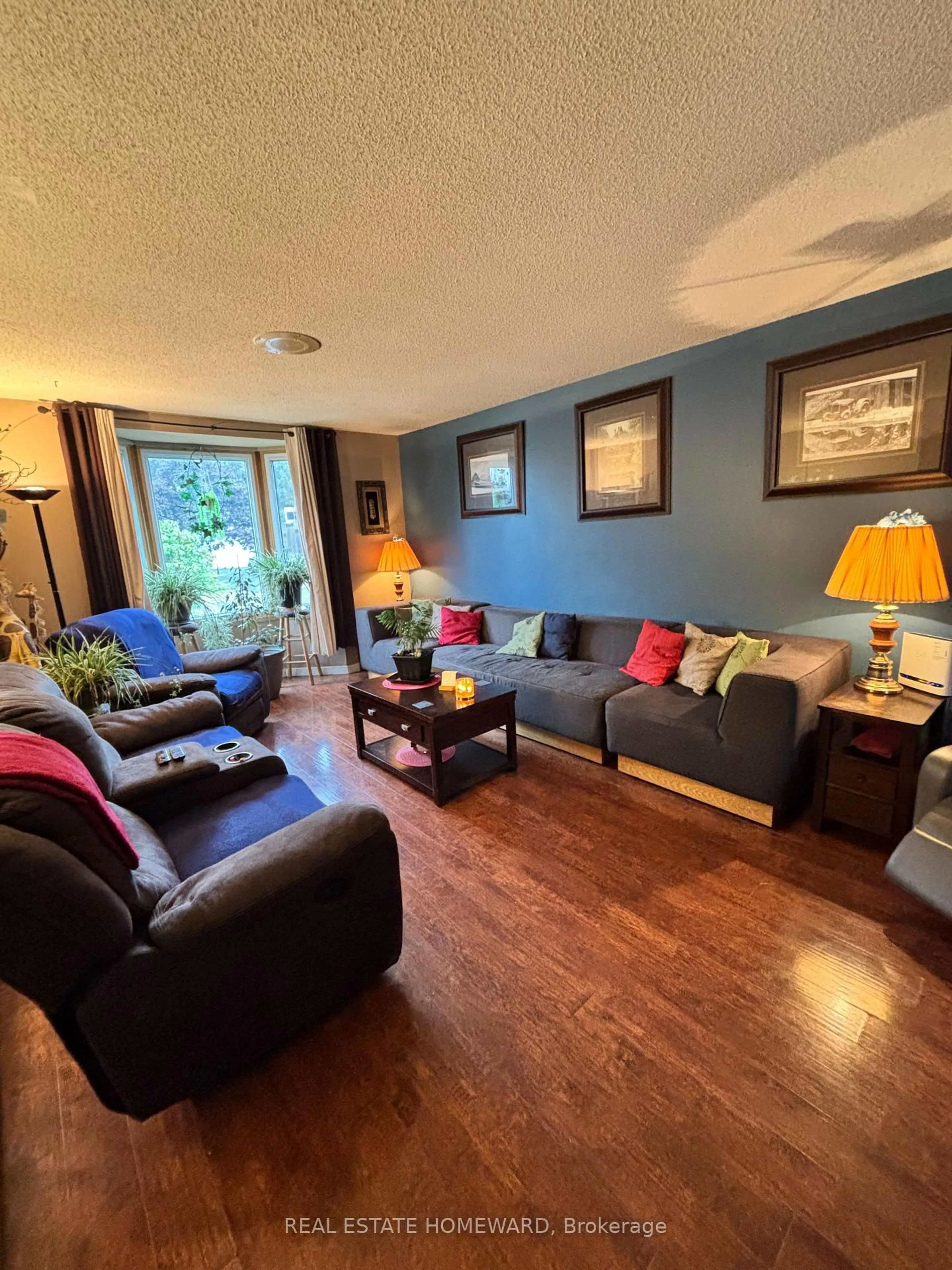 Living room with furniture, wood/laminate floor for 35 Bleeker Ave, Quinte West Ontario K8V 5Y2
