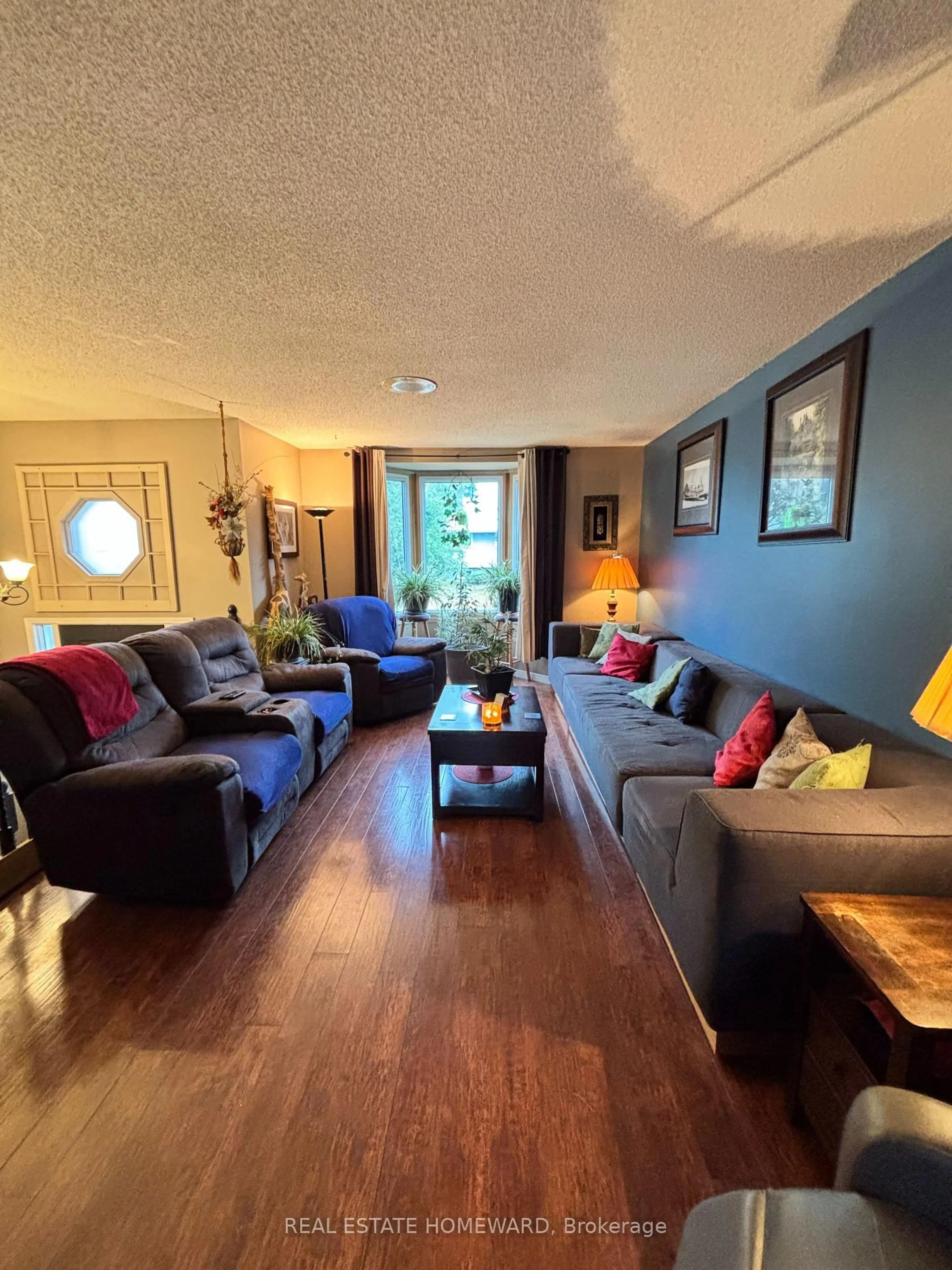 Living room with furniture, wood/laminate floor for 35 Bleeker Ave, Quinte West Ontario K8V 5Y2