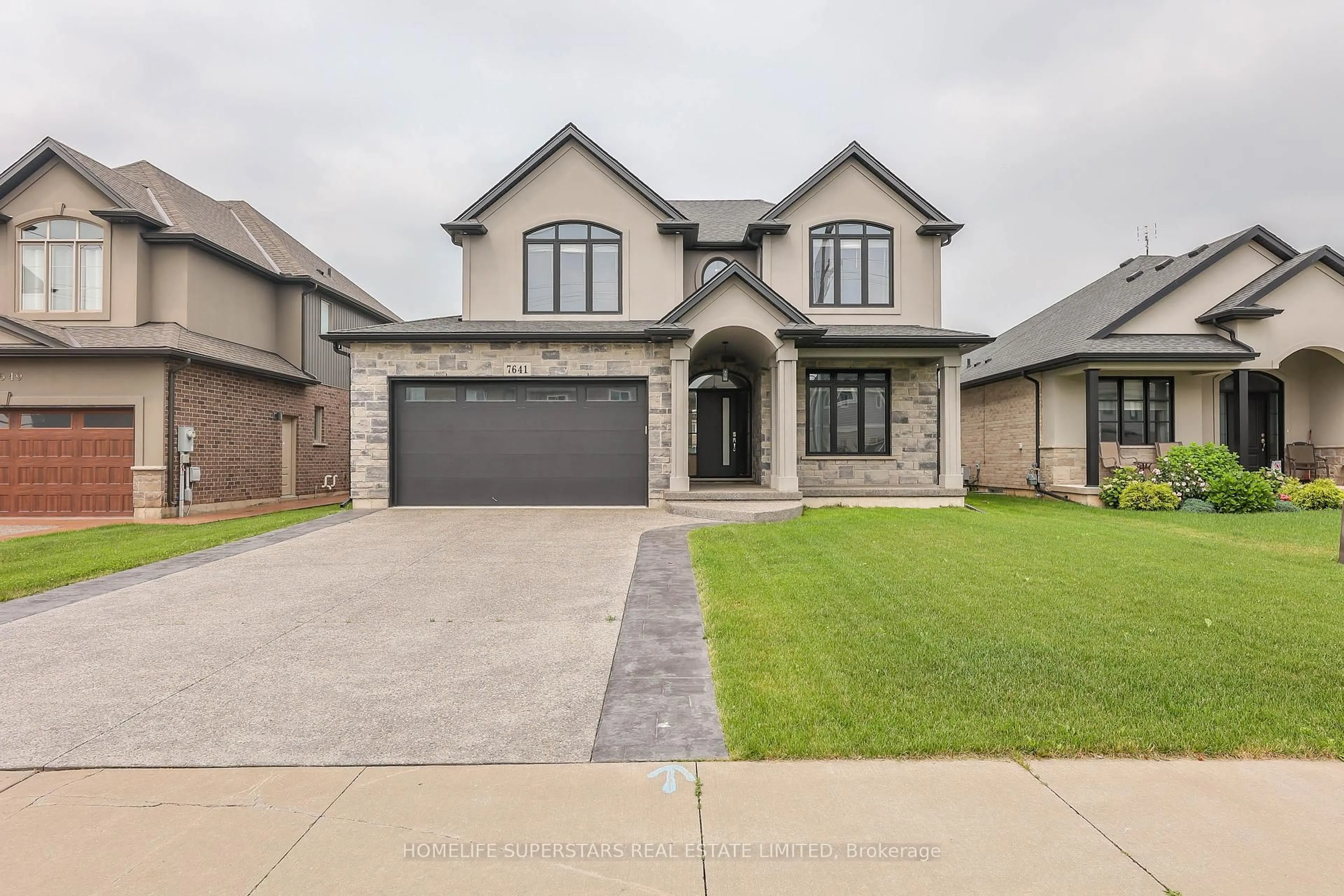 Home with brick exterior material, street for 7641 Drummond Rd, Niagara Falls Ontario L2G 4P9