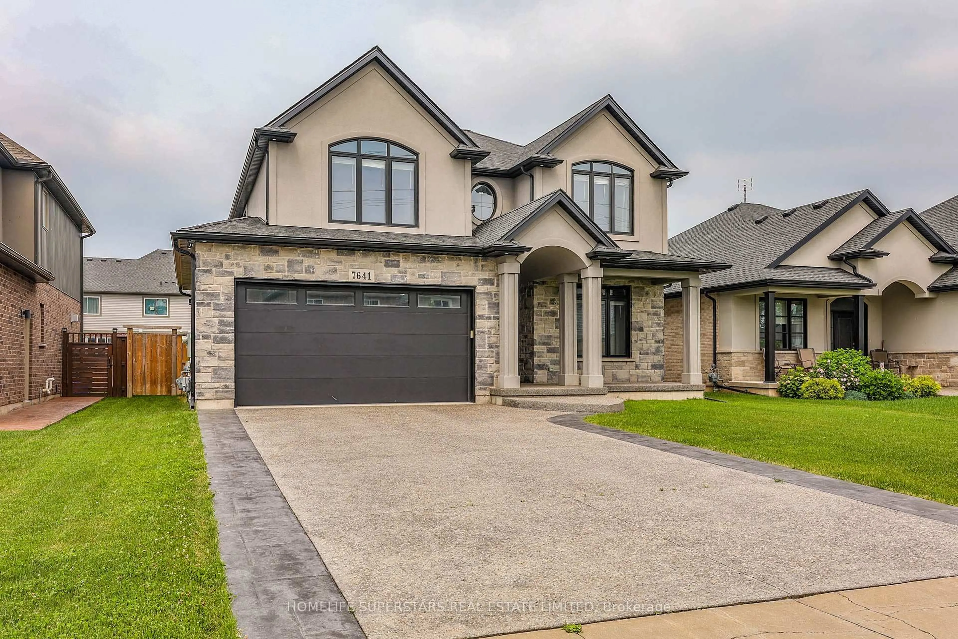 Home with brick exterior material, street for 7641 Drummond Rd, Niagara Falls Ontario L2G 4P9