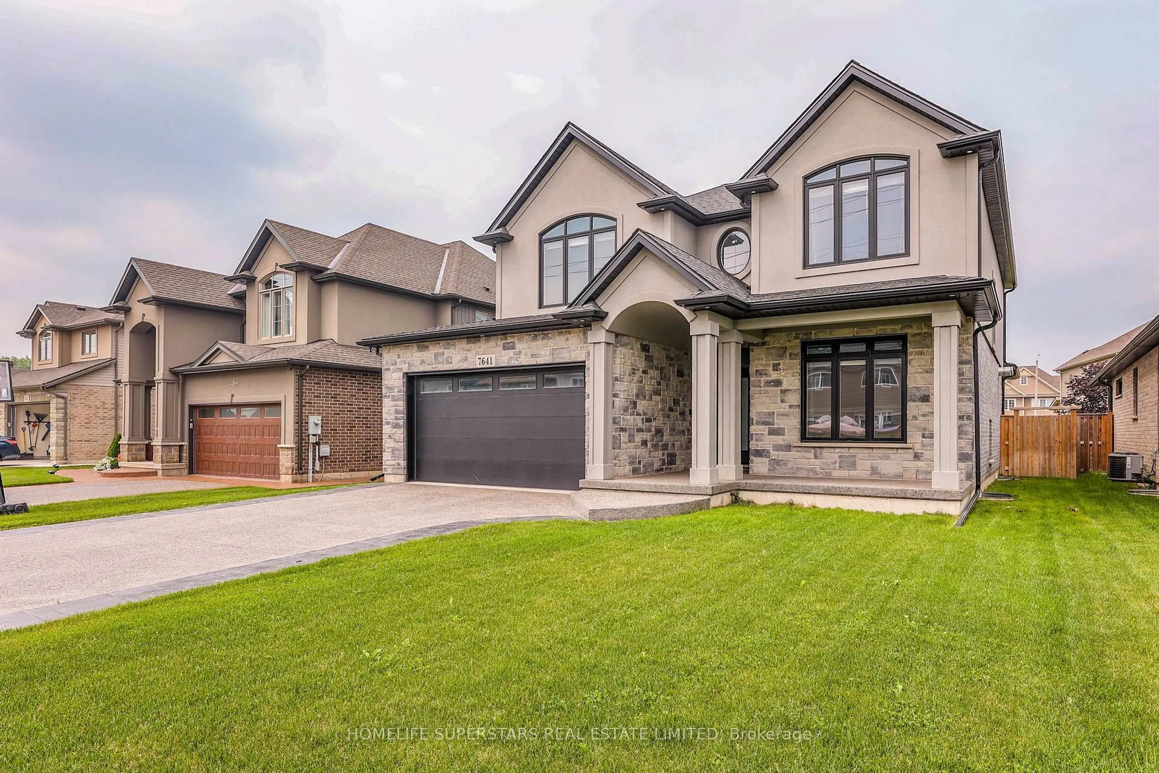 Home with brick exterior material, street for 7641 Drummond Rd, Niagara Falls Ontario L2G 4P9