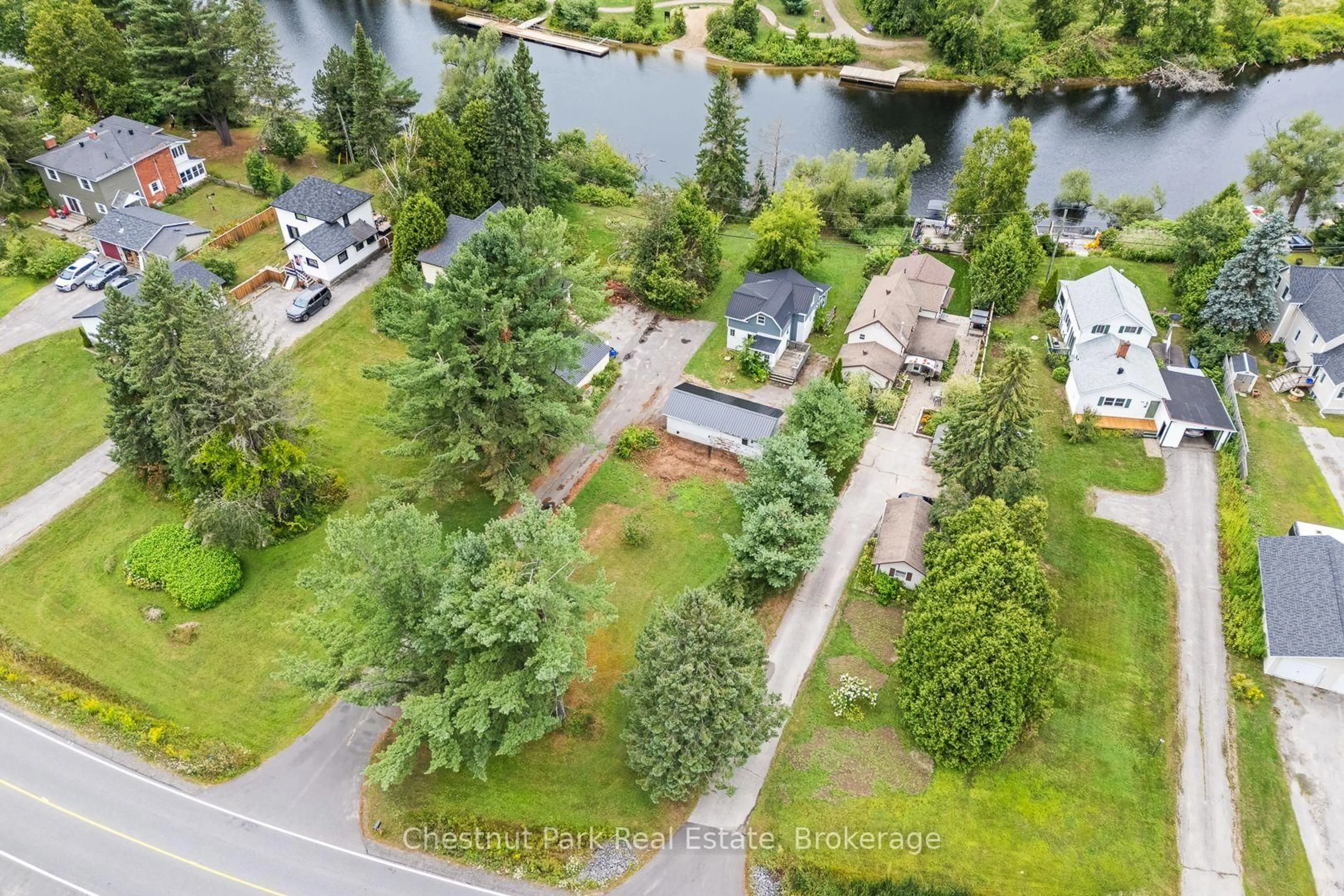 A pic from outside/outdoor area/front of a property/back of a property/a pic from drone, water/lake/river/ocean view for 68 Beaumont Dr, Bracebridge Ontario P1L 1X2