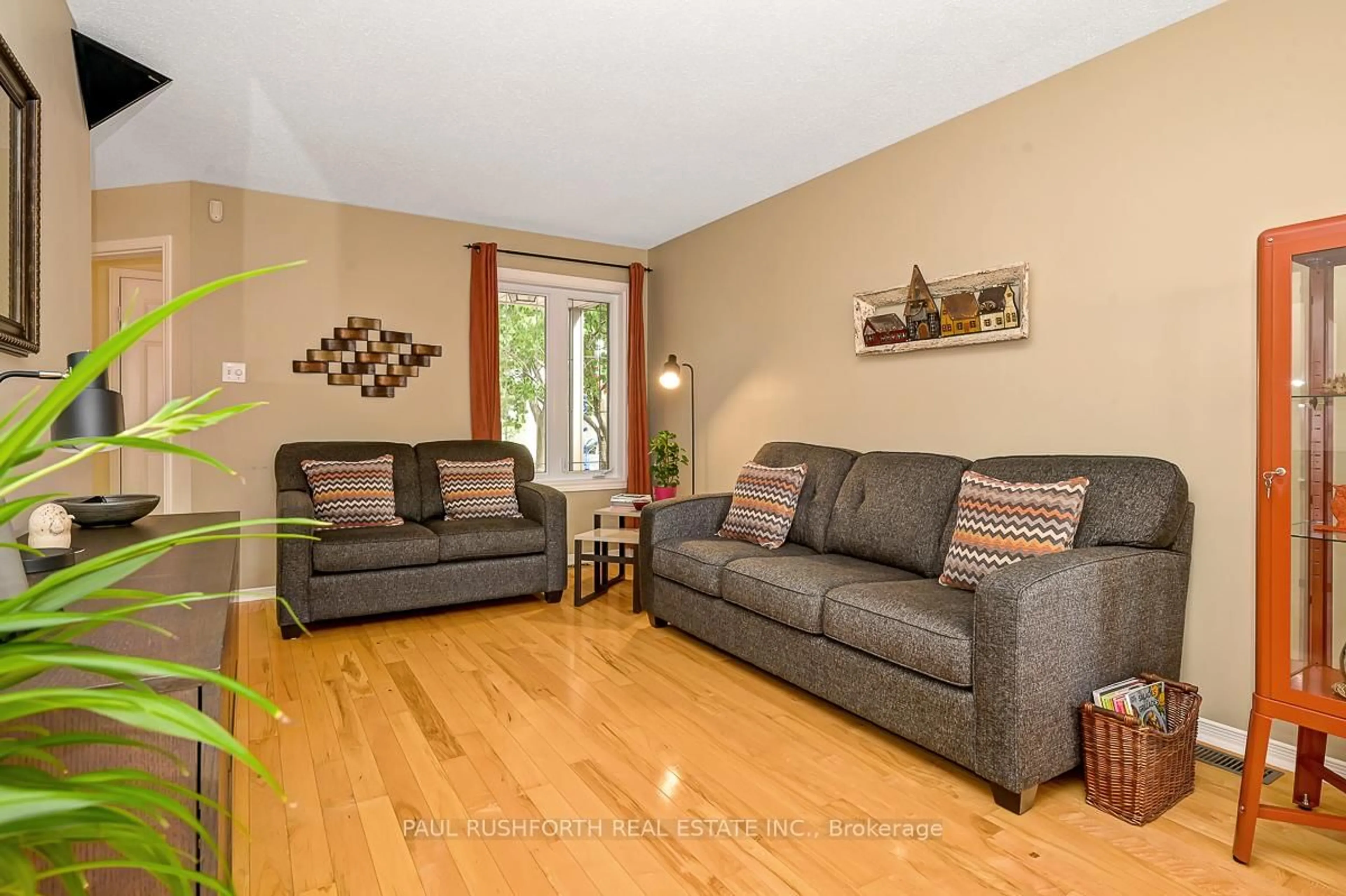 Living room with furniture, wood/laminate floor for 1853 Sunland Dr, Orleans Ontario K4A 3S8