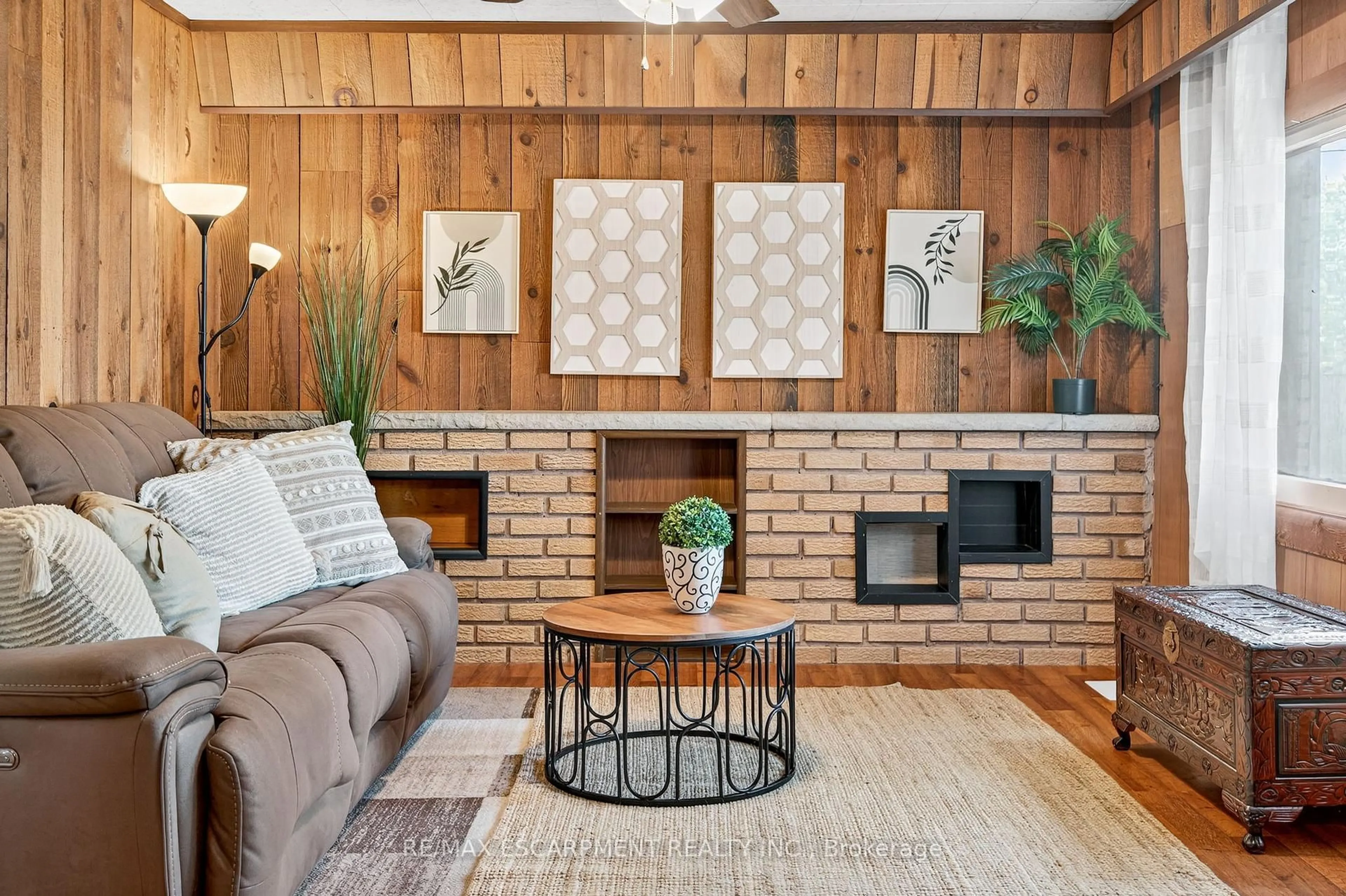 Living room with furniture, wood/laminate floor for 146 Normanhurst Ave, Hamilton Ontario L8H 5M8