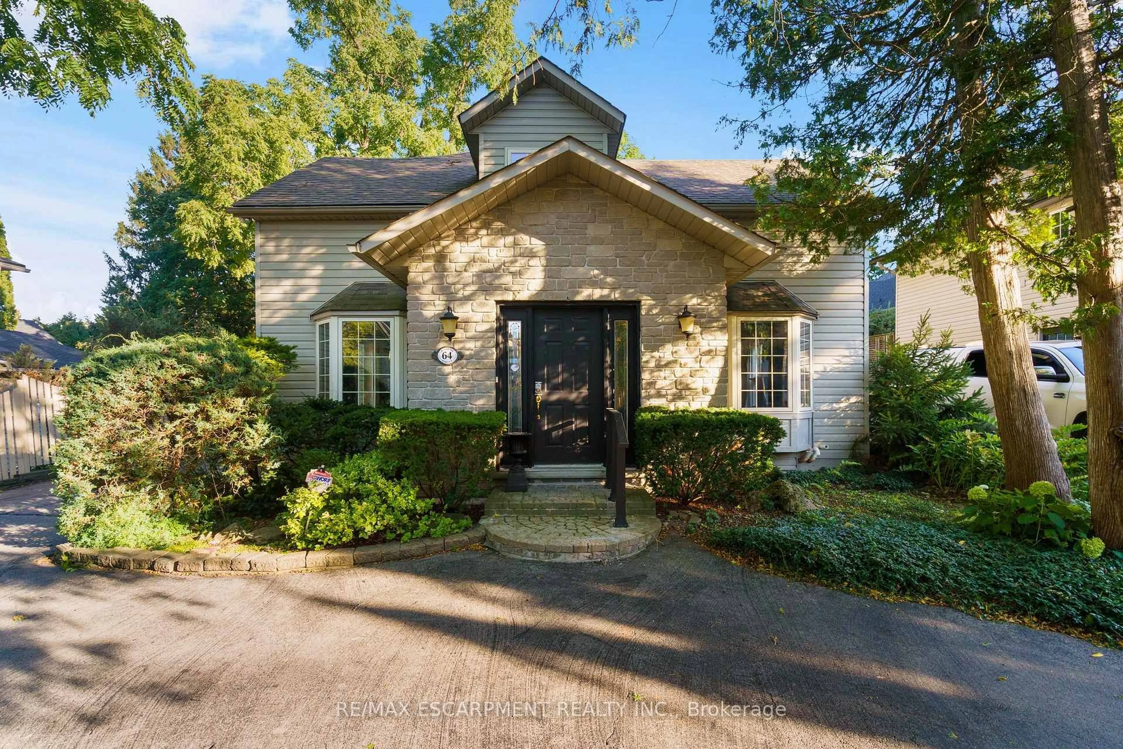 Home with brick exterior material, street for 64 Academy St, Hamilton Ontario L9G 2Y1