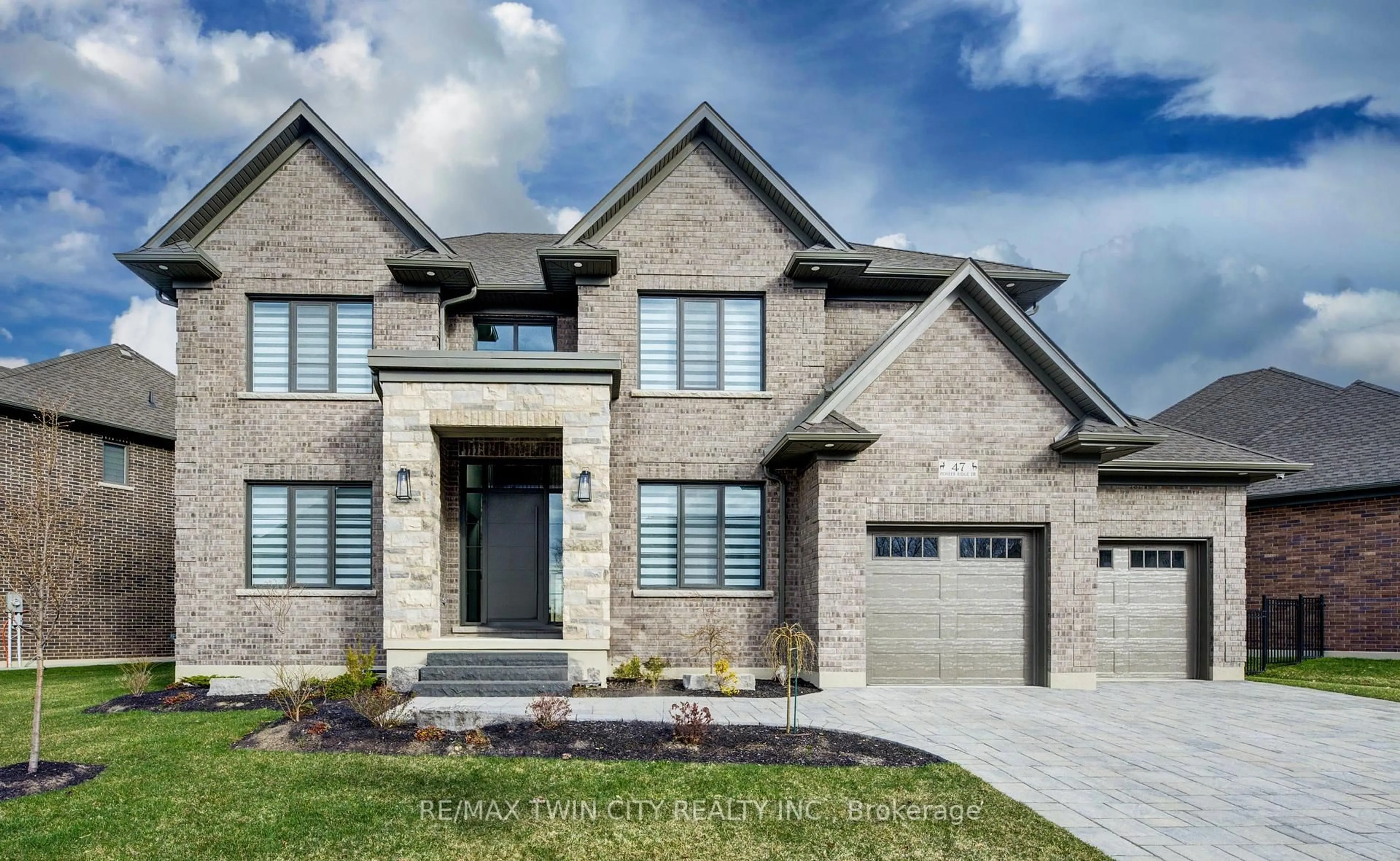 Home with brick exterior material, street for 47 Pioneer Ridge Dr, Kitchener Ontario N2P 0G6