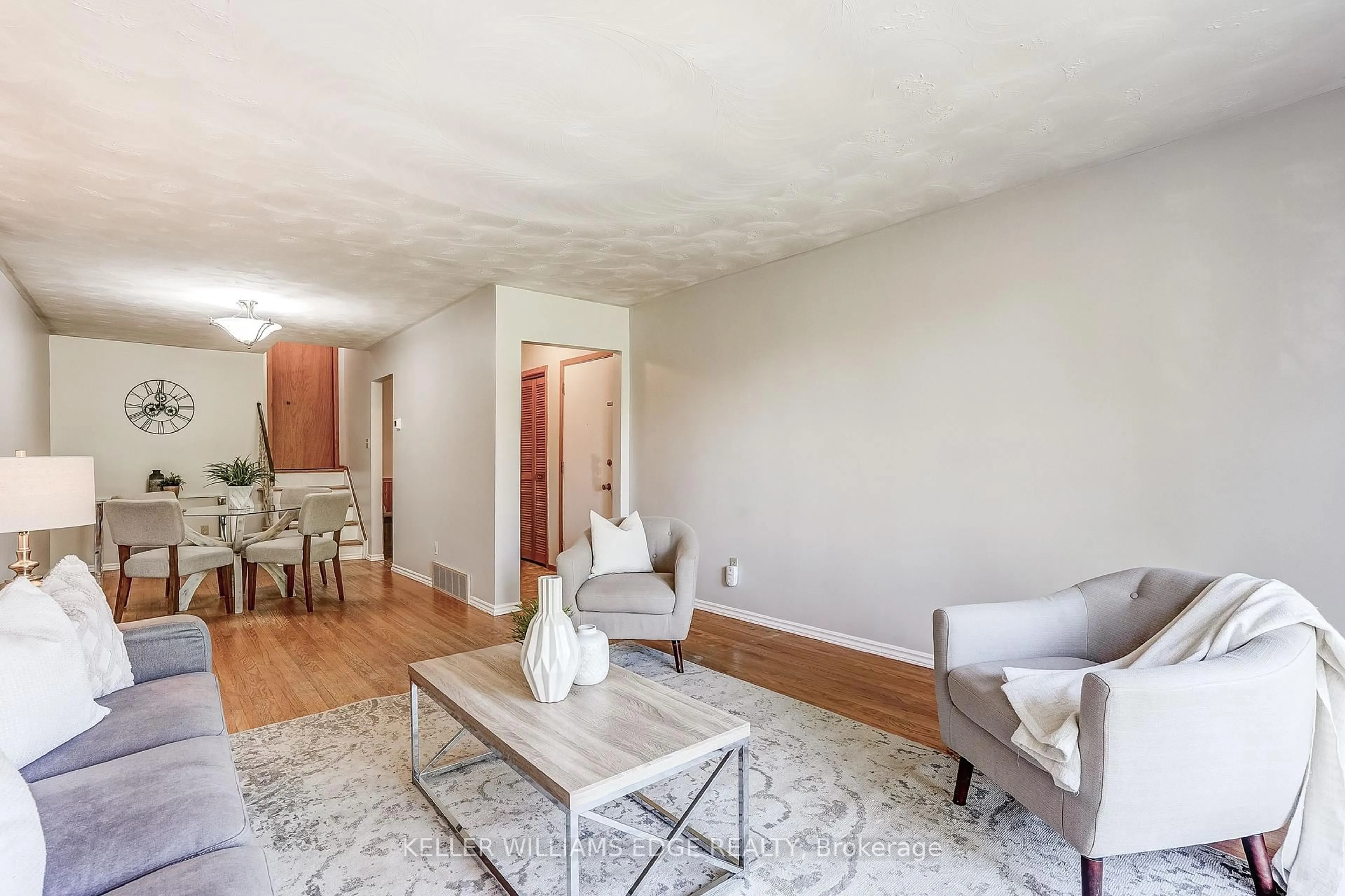 Living room with furniture, wood/laminate floor for 63 1/2 Eastbury Dr, Hamilton Ontario L8E 2V8