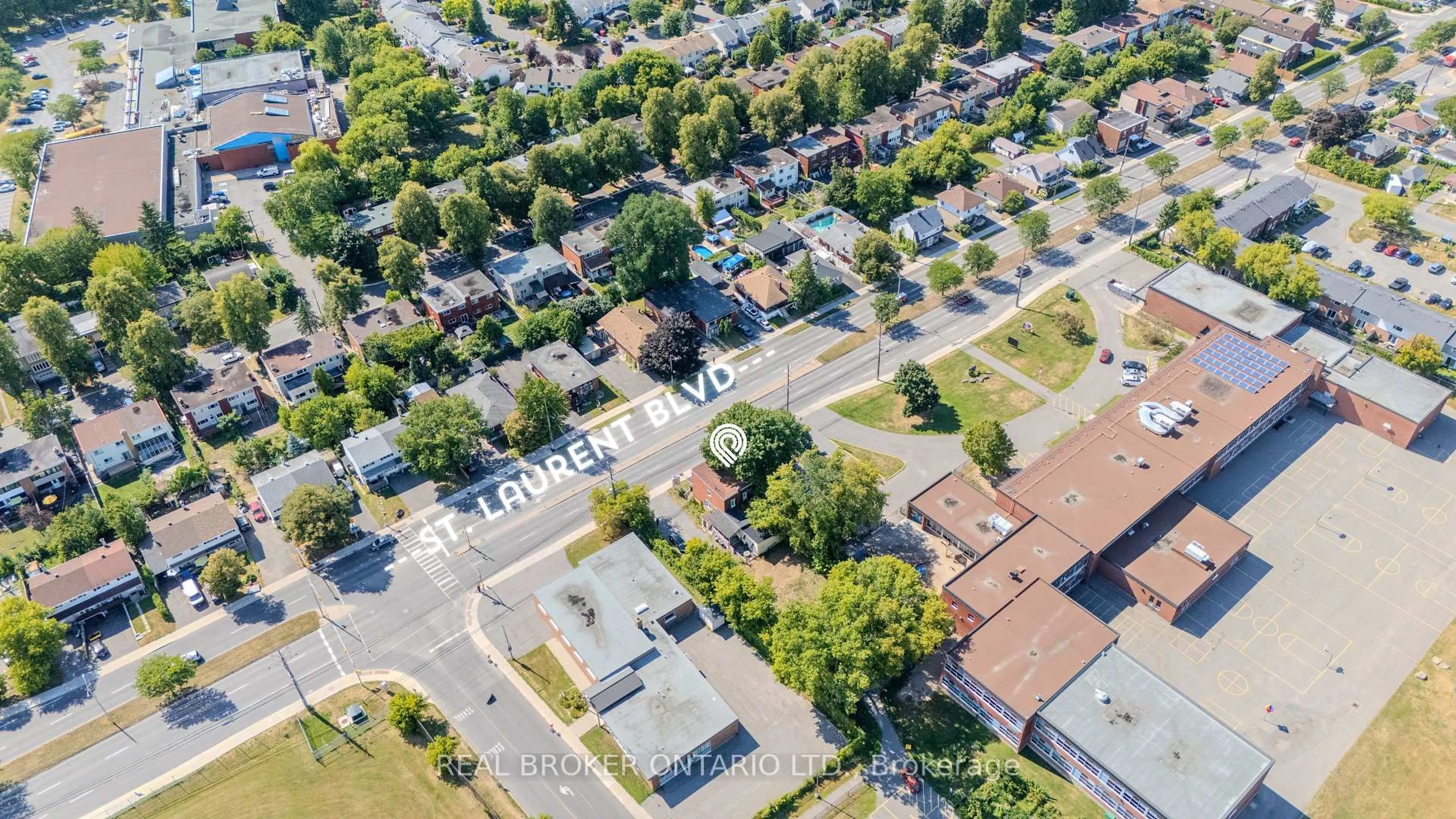 A pic from outside/outdoor area/front of a property/back of a property/a pic from drone, street for 713 St Laurent Blvd, Ottawa Ontario K1K 3A6
