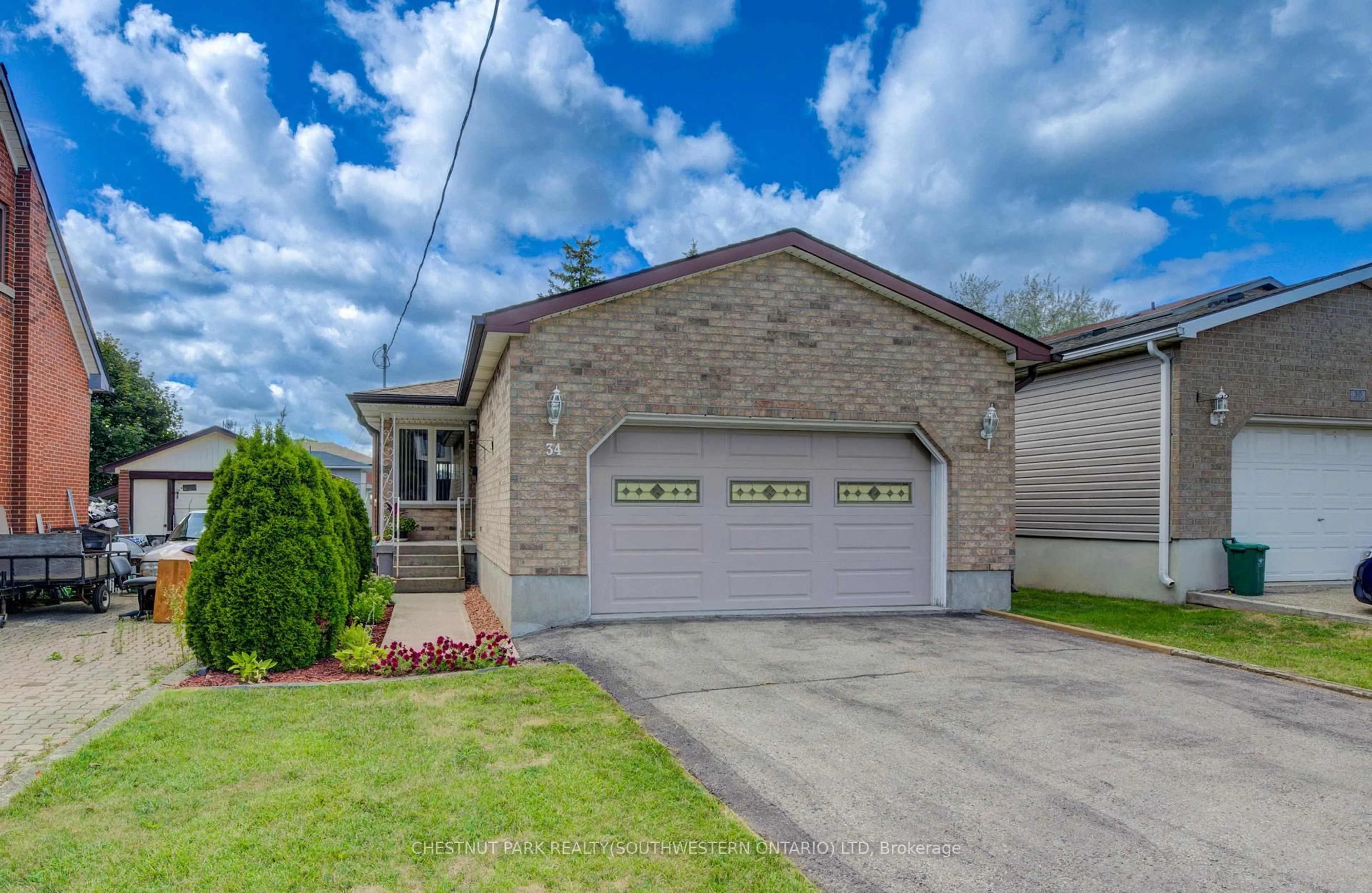 Home with brick exterior material, street for 34 4th Ave, Kitchener Ontario N2C 1N8