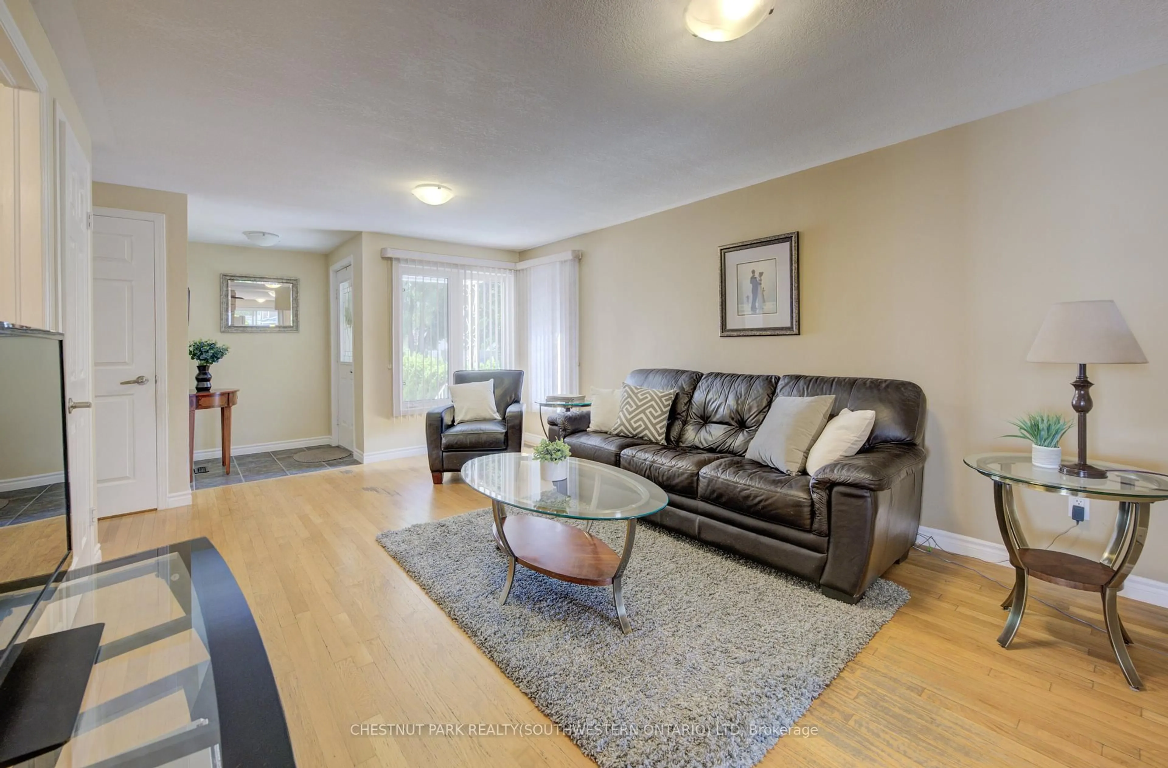 Living room with furniture, wood/laminate floor for 34 4th Ave, Kitchener Ontario N2C 1N8