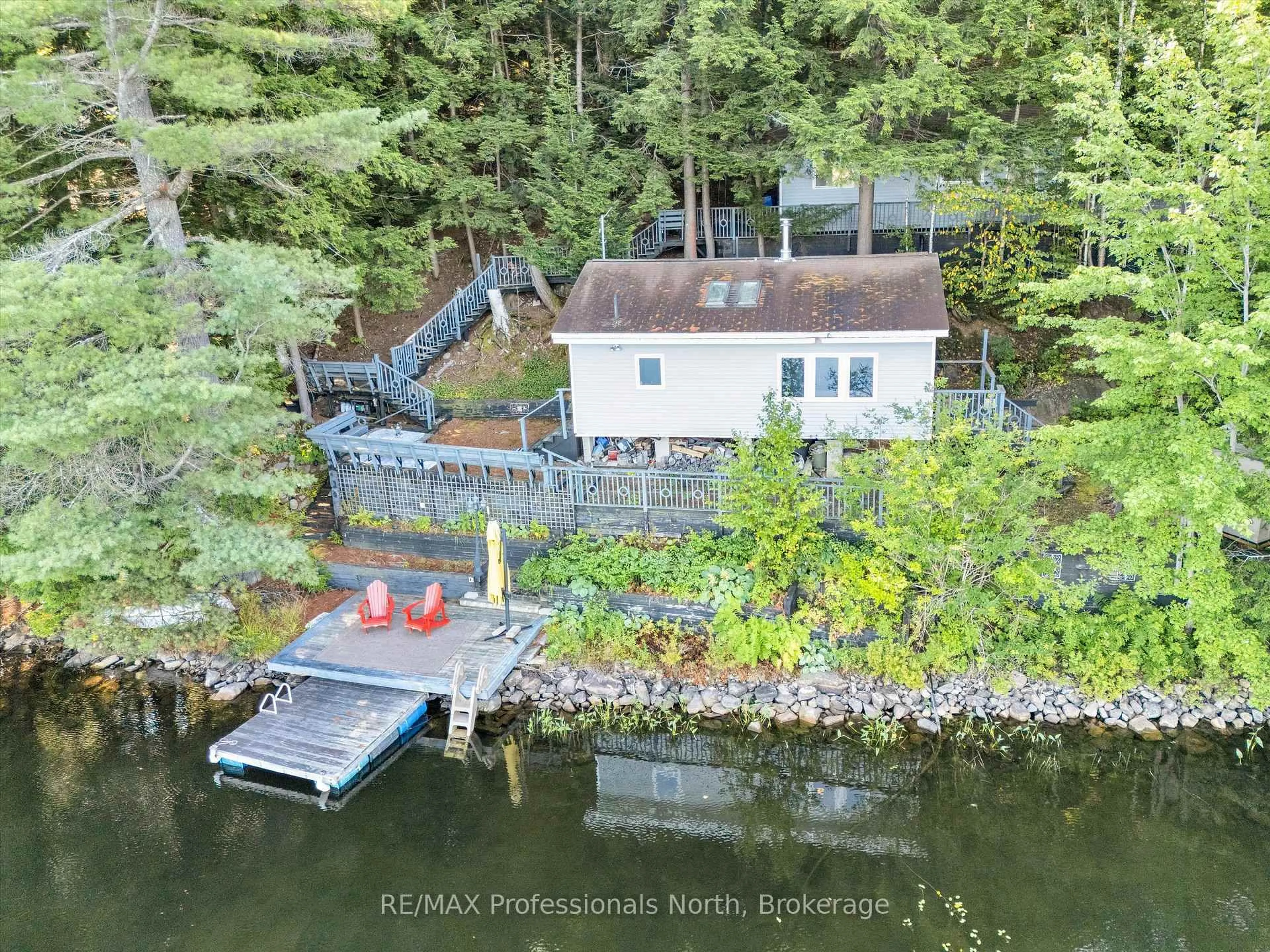 A pic from outside/outdoor area/front of a property/back of a property/a pic from drone, water/lake/river/ocean view for 1014 Twilight Close Crt, Algonquin Highlands Ontario P0A 1E0