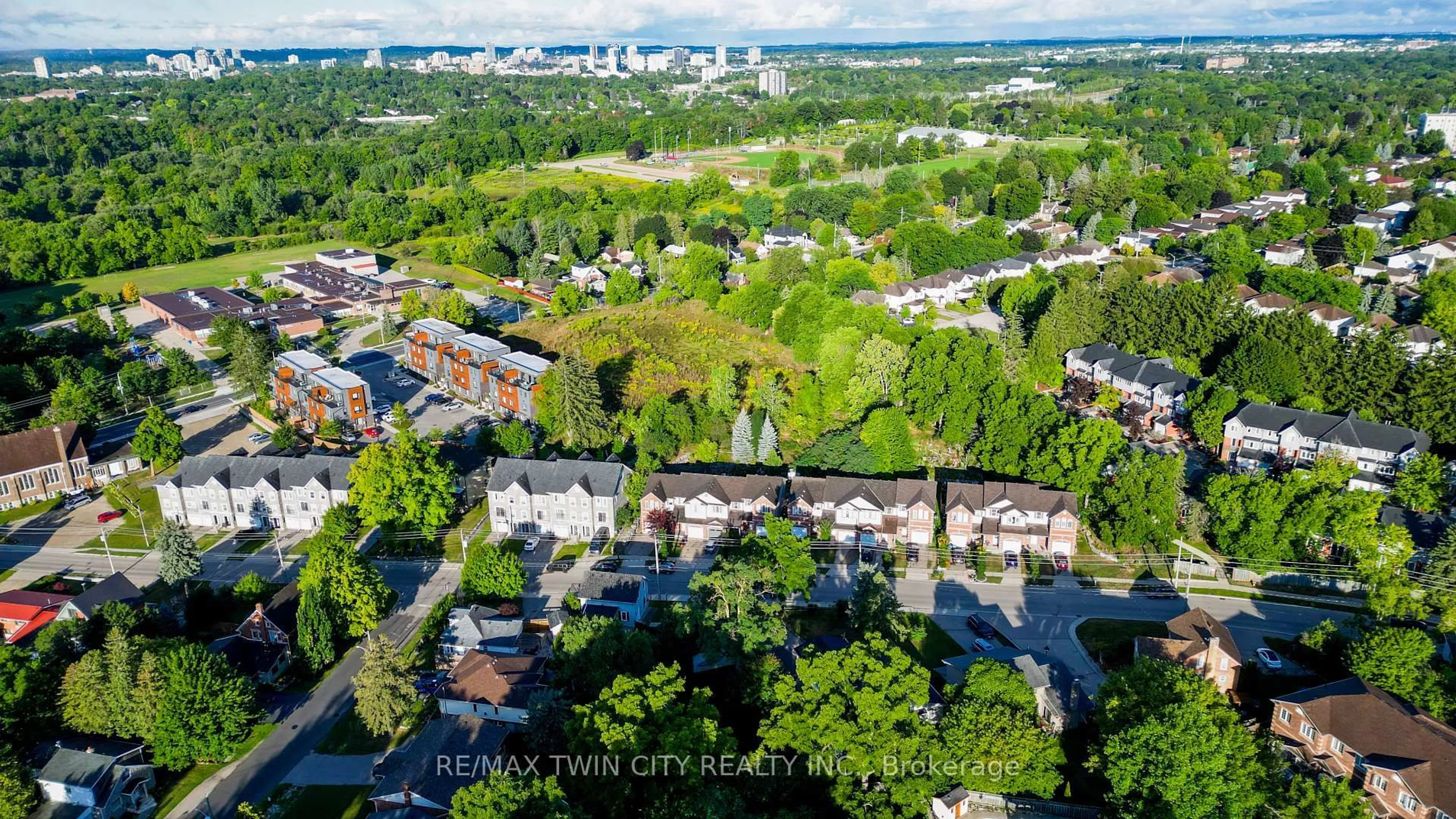 A pic from outside/outdoor area/front of a property/back of a property/a pic from drone, city buildings view from balcony for 64 Woolwich St, Kitchener Ontario N2K 1S3