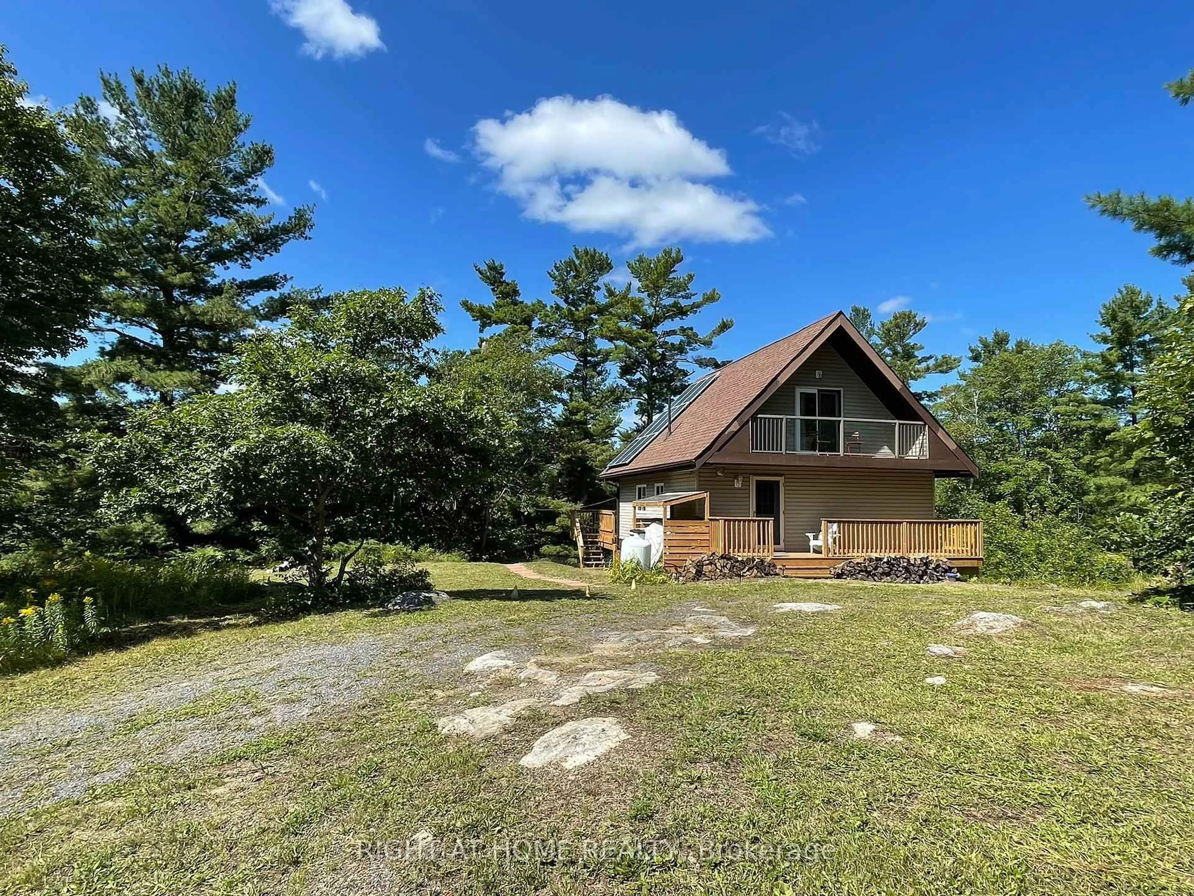A pic from outside/outdoor area/front of a property/back of a property/a pic from drone, unknown for 794 HWY 518, Seguin Ontario P2A 2W9