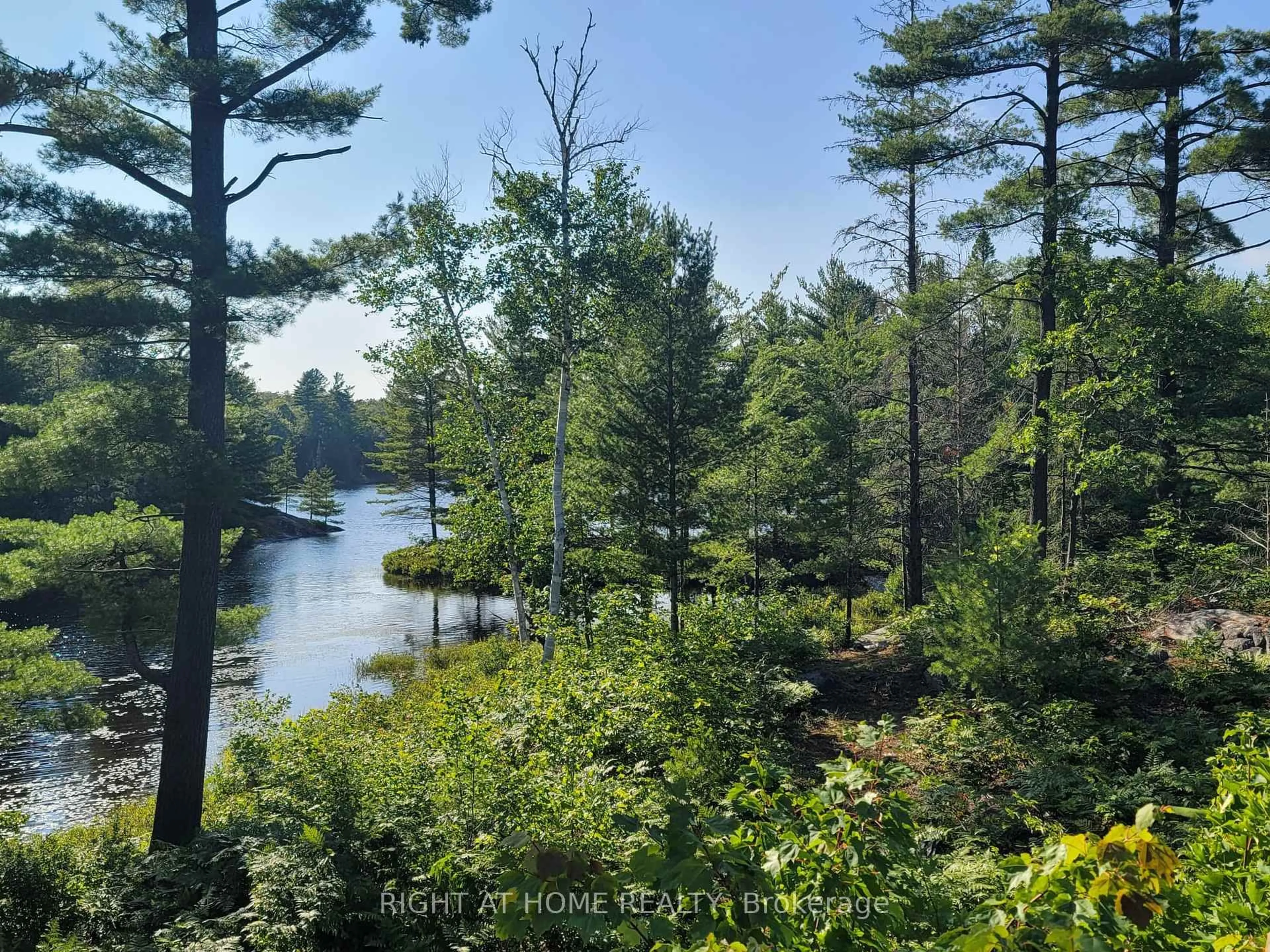 A pic from outside/outdoor area/front of a property/back of a property/a pic from drone, water/lake/river/ocean view for 794 HWY 518, Seguin Ontario P2A 2W9