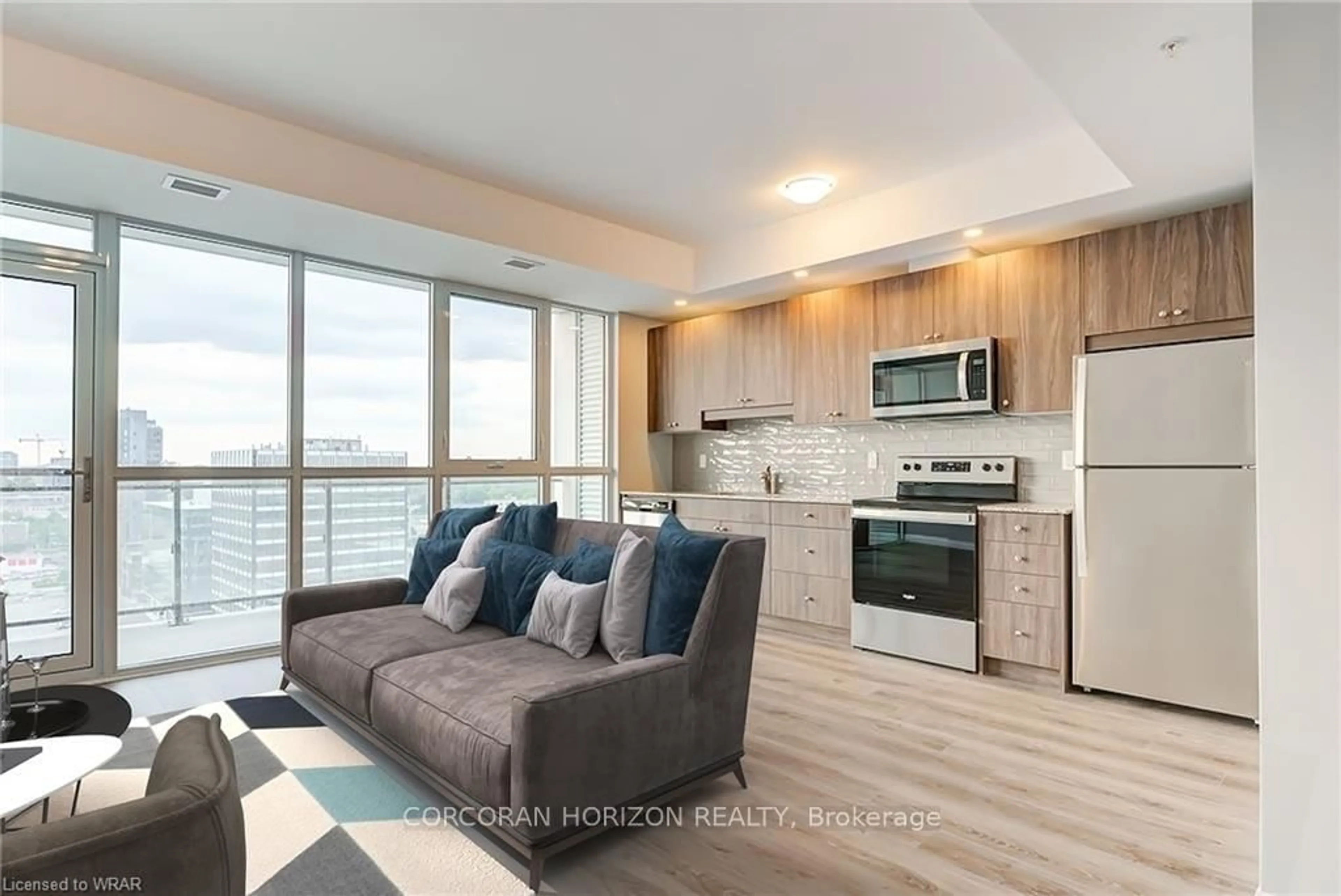 Open concept kitchen, wood/laminate floor for 60 Charles St #1409A, Kitchener Ontario N2G 0C9