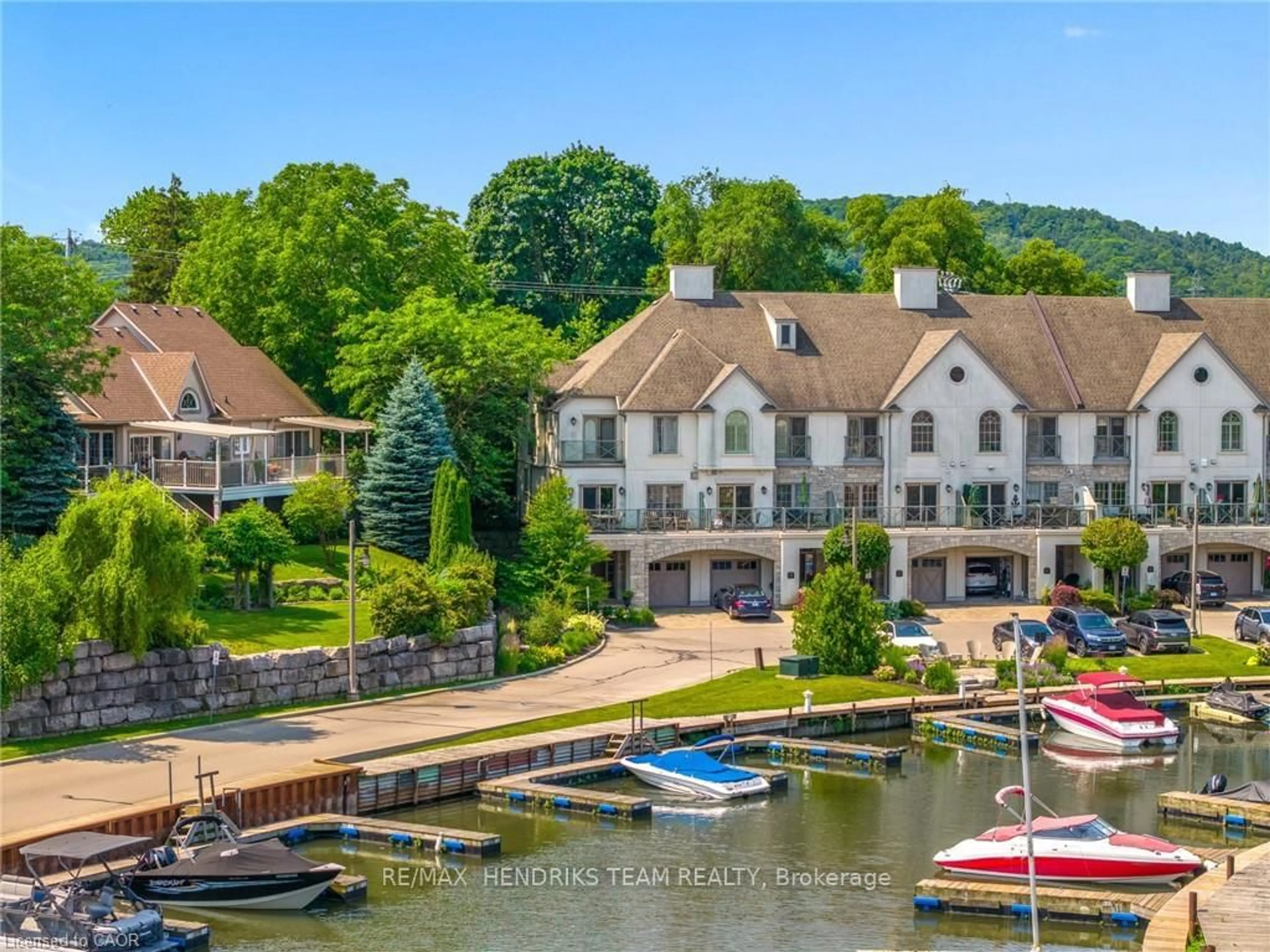 A pic from outside/outdoor area/front of a property/back of a property/a pic from drone, water/lake/river/ocean view for 19 Lake St #20, Grimsby Ontario L3M 0C3