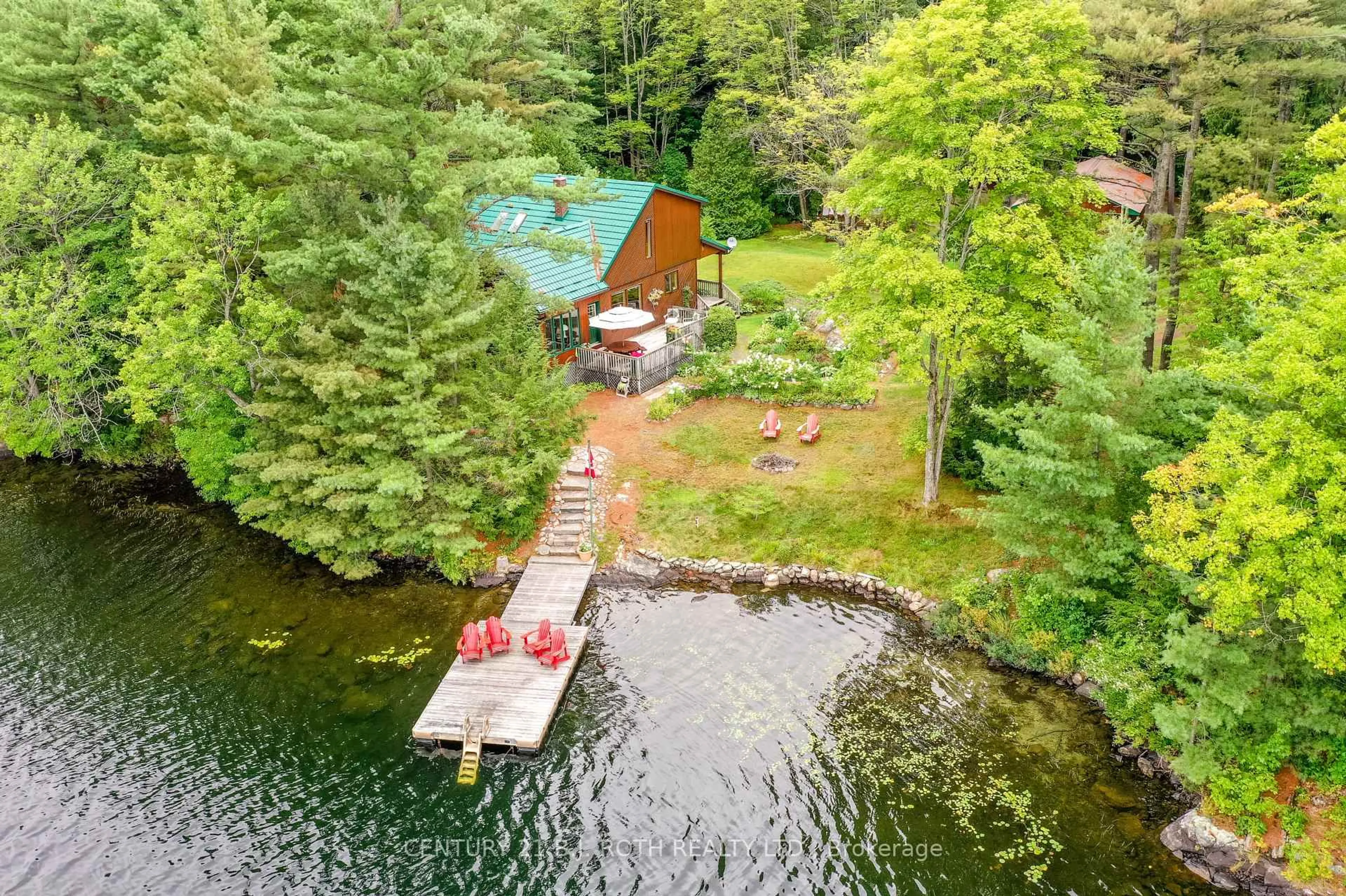 A pic from outside/outdoor area/front of a property/back of a property/a pic from drone, water/lake/river/ocean view for 29 Nestor's Lane, Seguin Ontario T2A 0B2