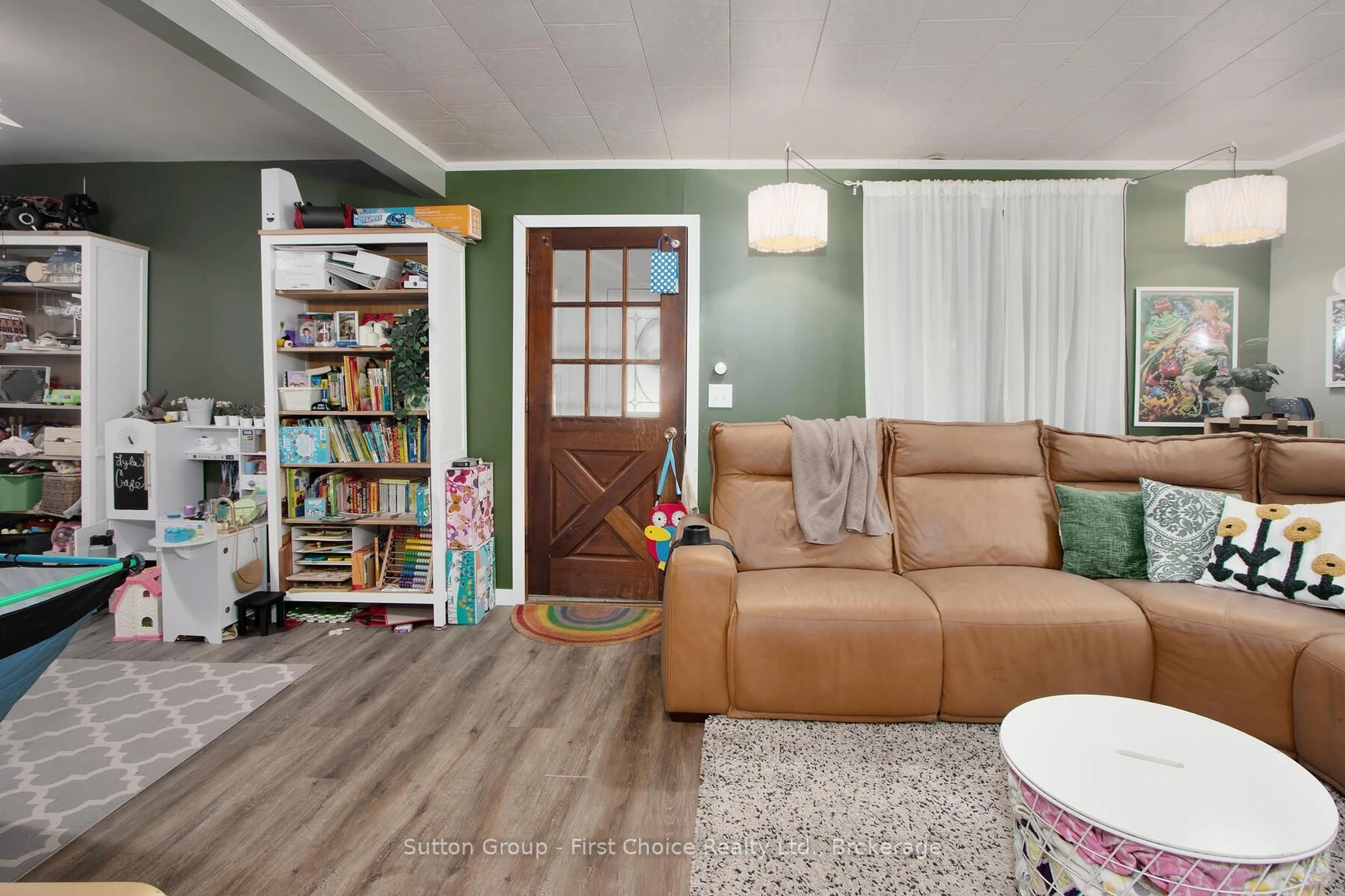 Living room with furniture, wood/laminate floor for 27 Arthur St, West Perth Ontario N0K 1N0