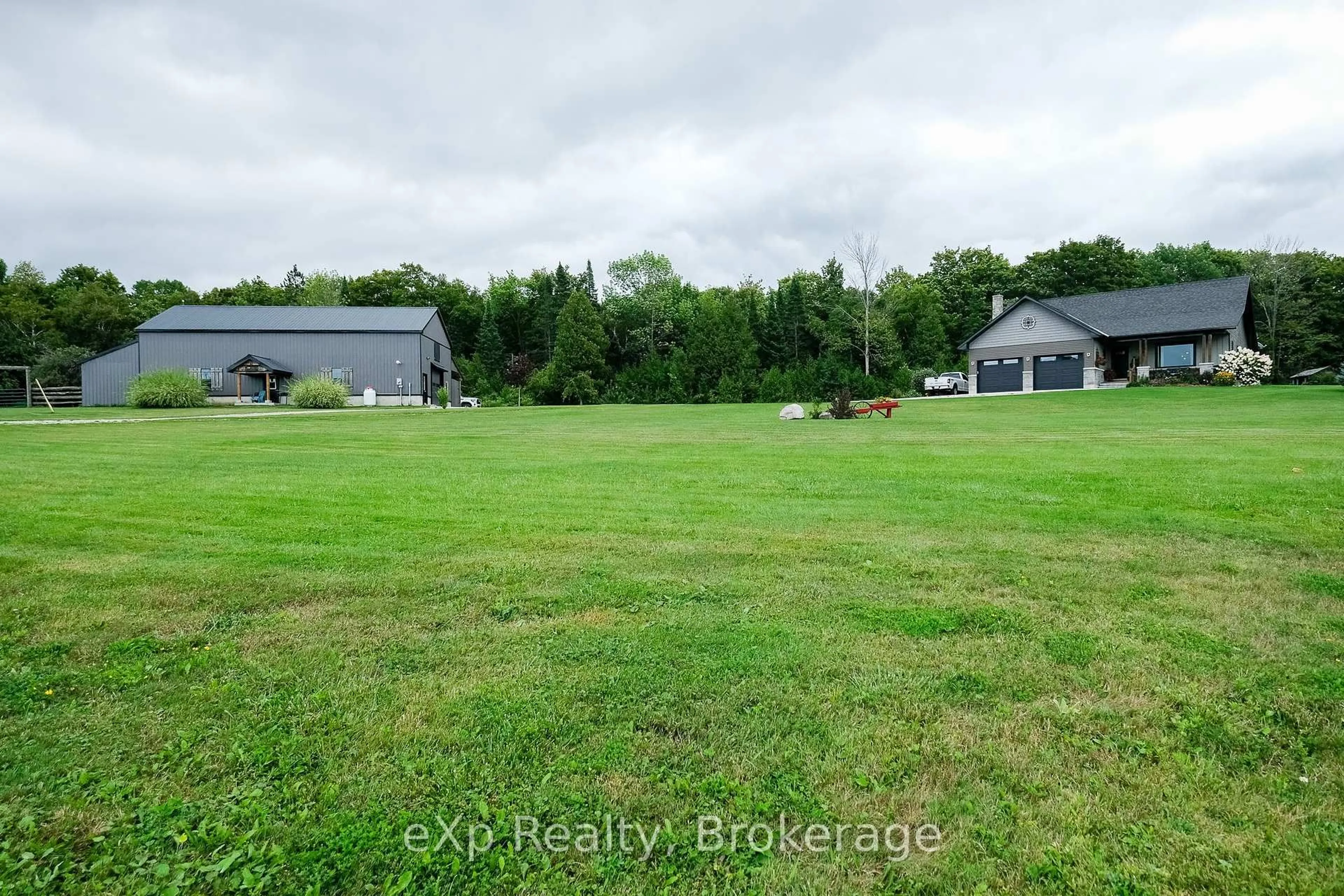 A pic from outside/outdoor area/front of a property/back of a property/a pic from drone, water/lake/river/ocean view for 502032 Grey Road 1, Georgian Bluffs Ontario N0H 2T0