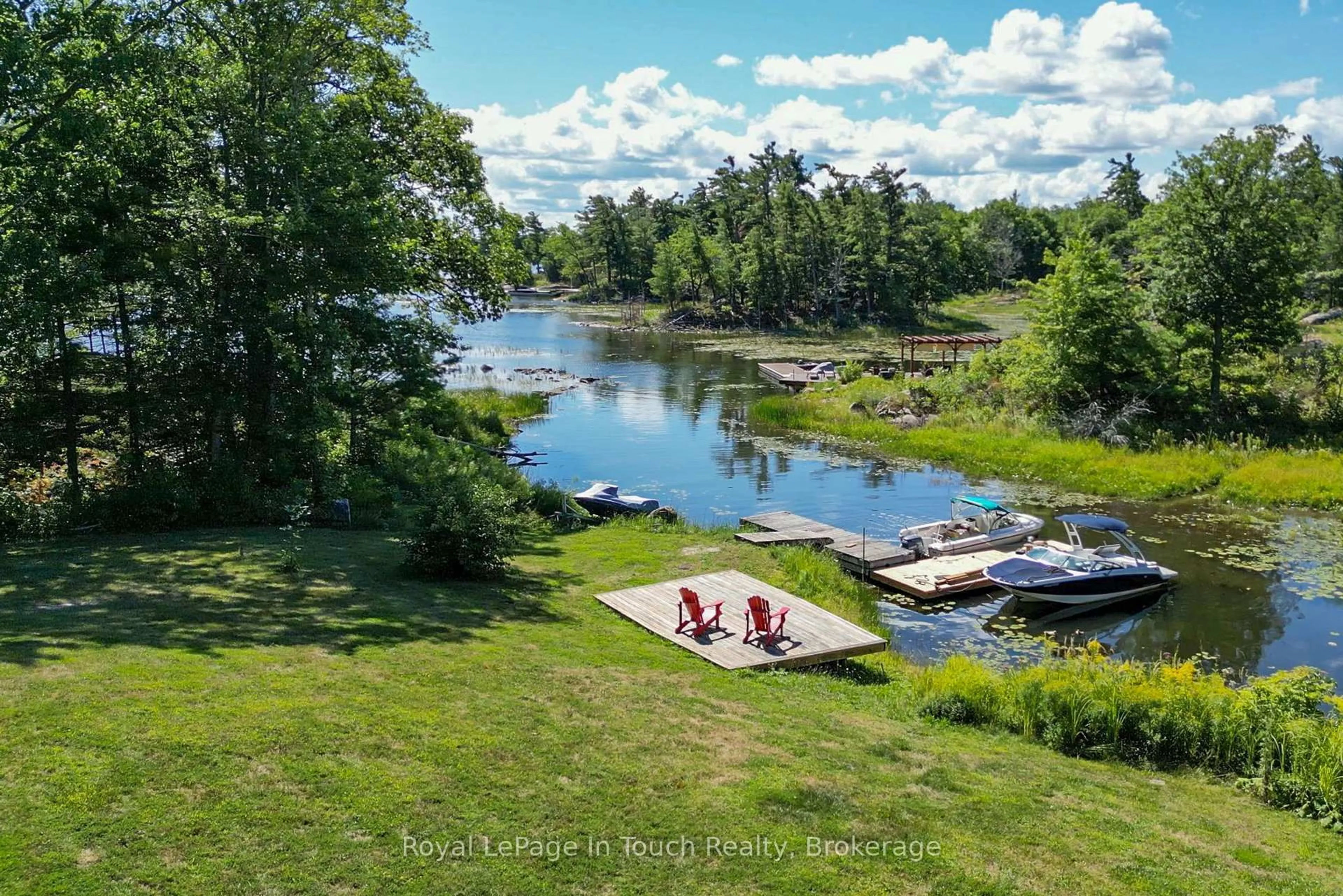 A pic from outside/outdoor area/front of a property/back of a property/a pic from drone, water/lake/river/ocean view for 2974 Island 1040, Georgian Bay Ontario P0E 1E0