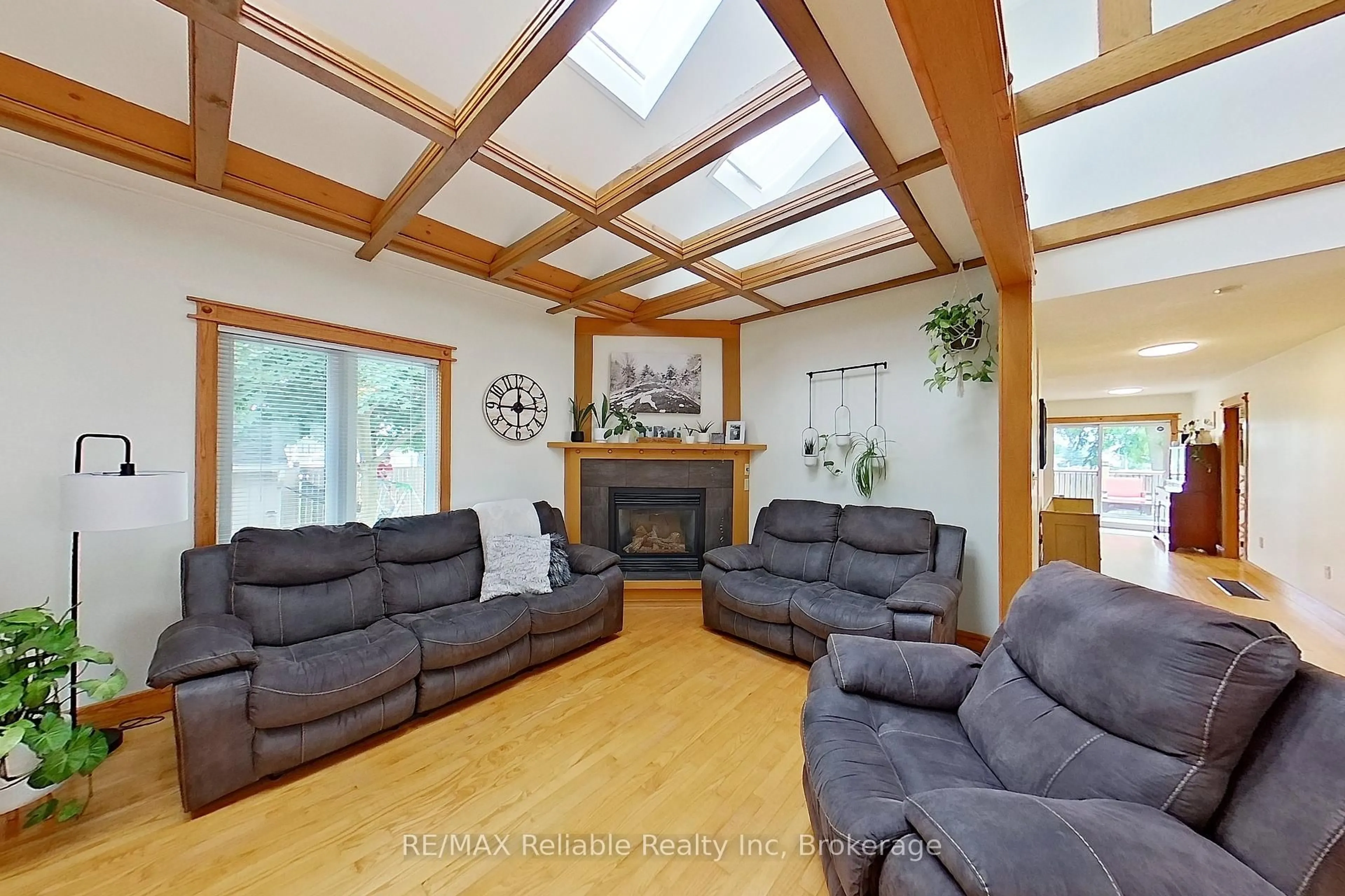 Living room with furniture, wood/laminate floor for 212 James St, Central Huron Ontario N0M 1L0