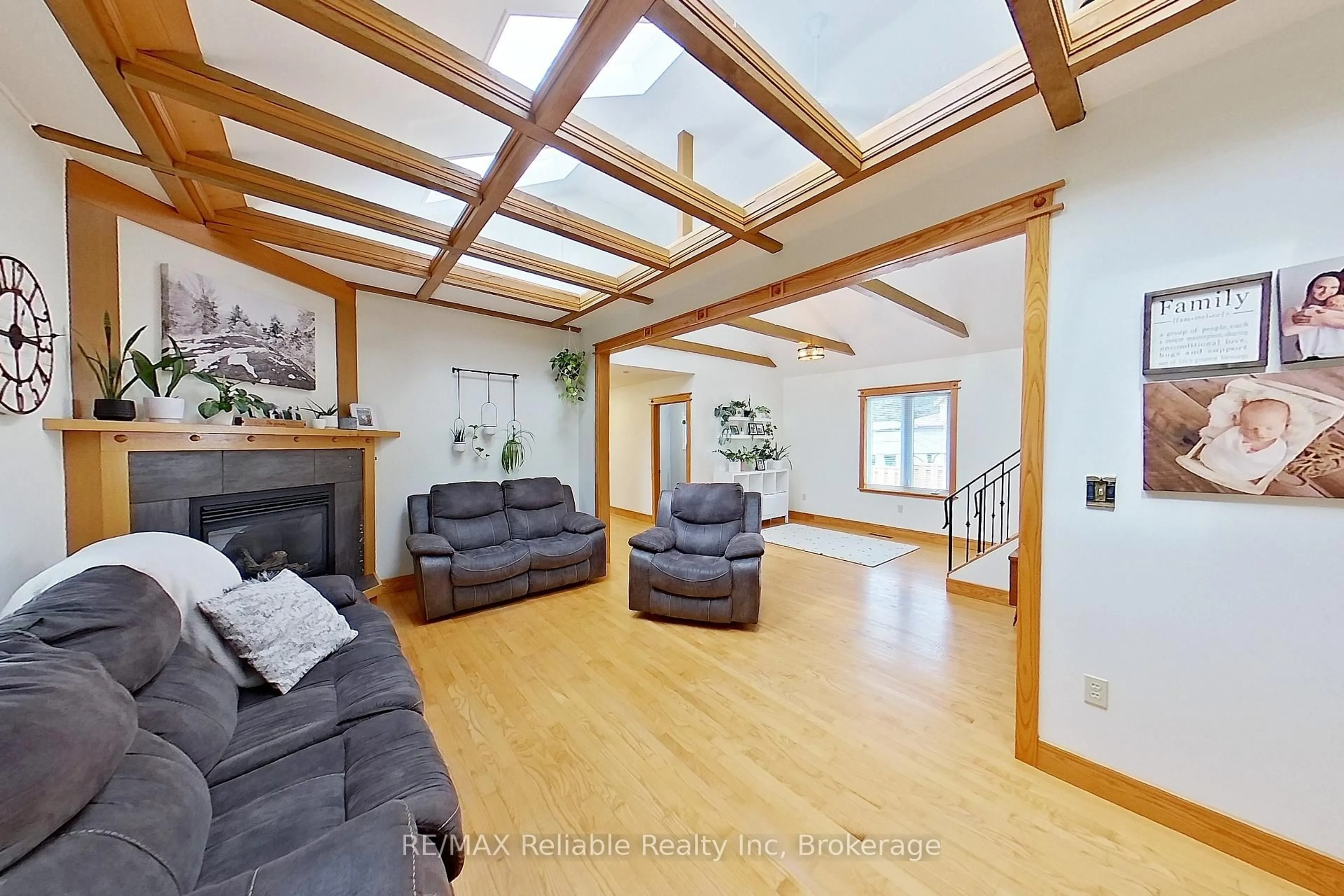 Living room with furniture, wood/laminate floor for 212 James St, Central Huron Ontario N0M 1L0