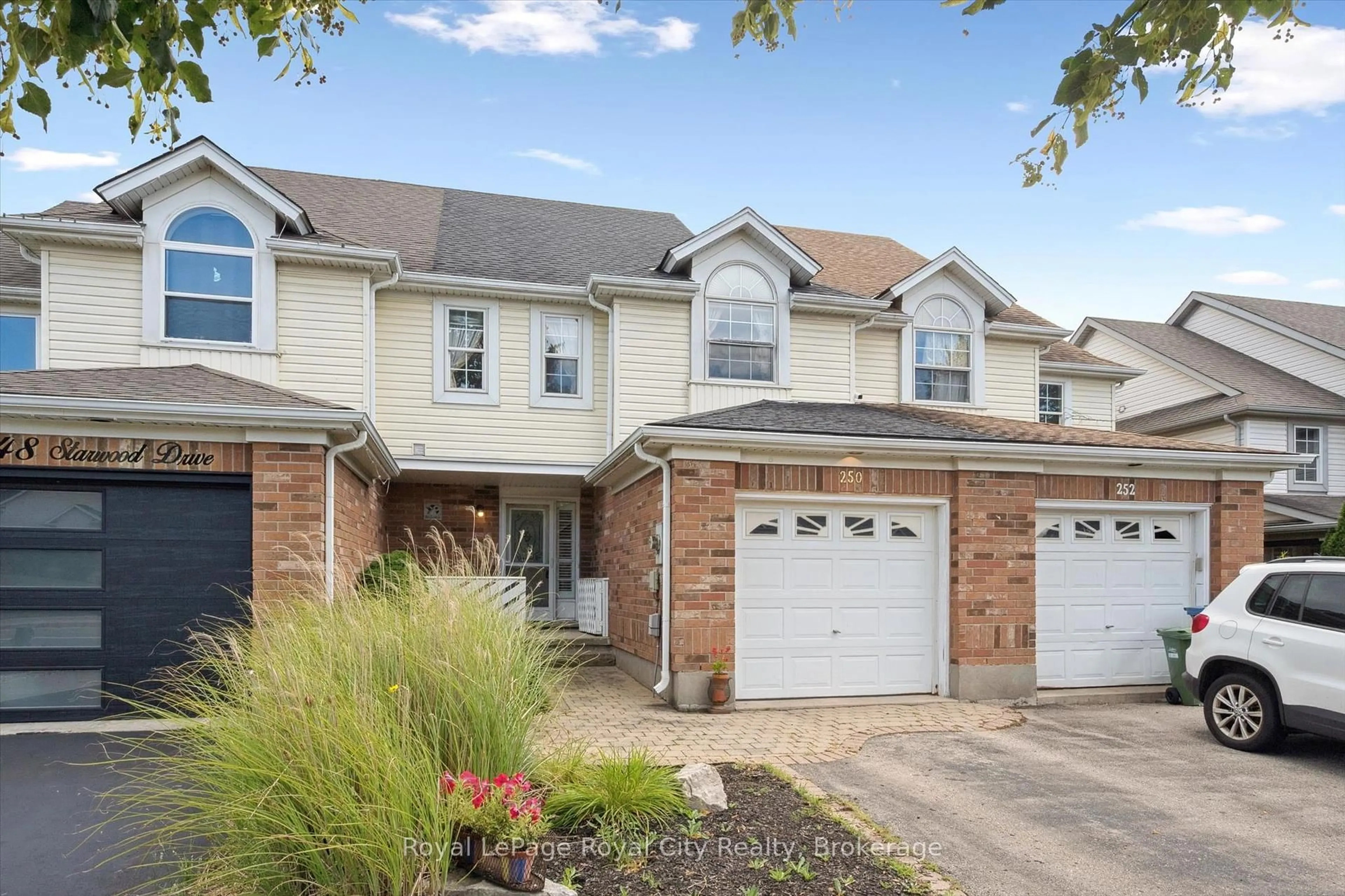 Home with brick exterior material, street for 250 Starwood Dr, Guelph Ontario N1E 7C1