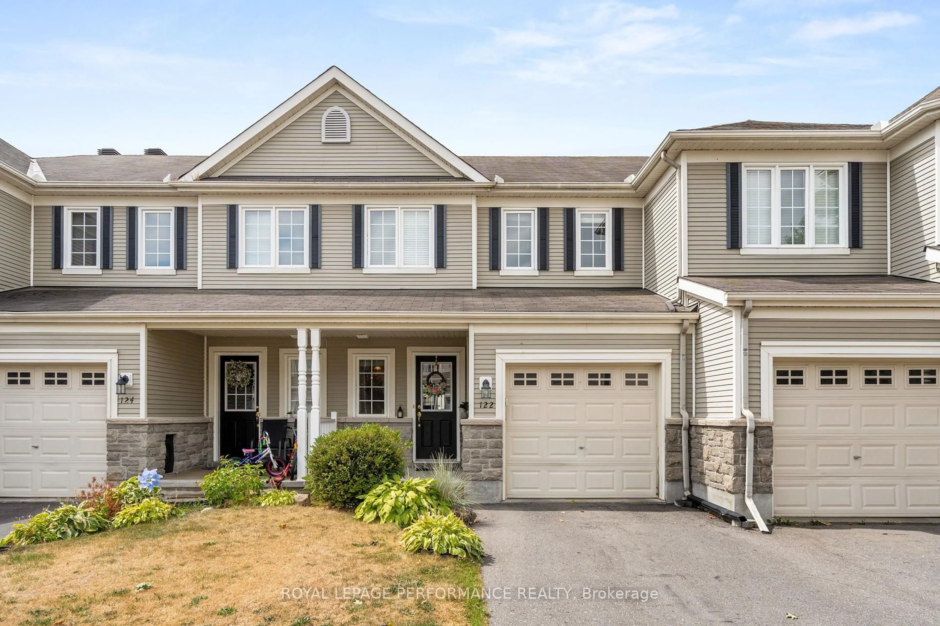 Home with vinyl exterior material, street for 122 Osnabrook Private, Ottawa Ontario K2J 0G8