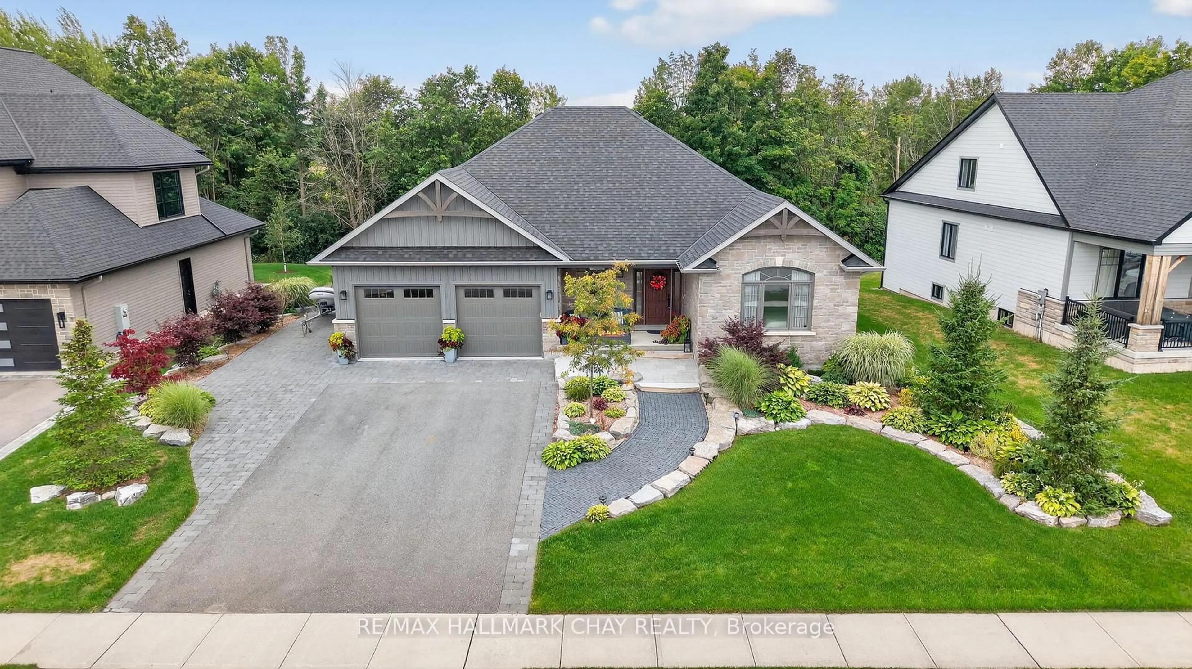 A pic from outside/outdoor area/front of a property/back of a property/a pic from drone, street for 127 High Bluff Lane, Blue Mountains Ontario N0H 2P0