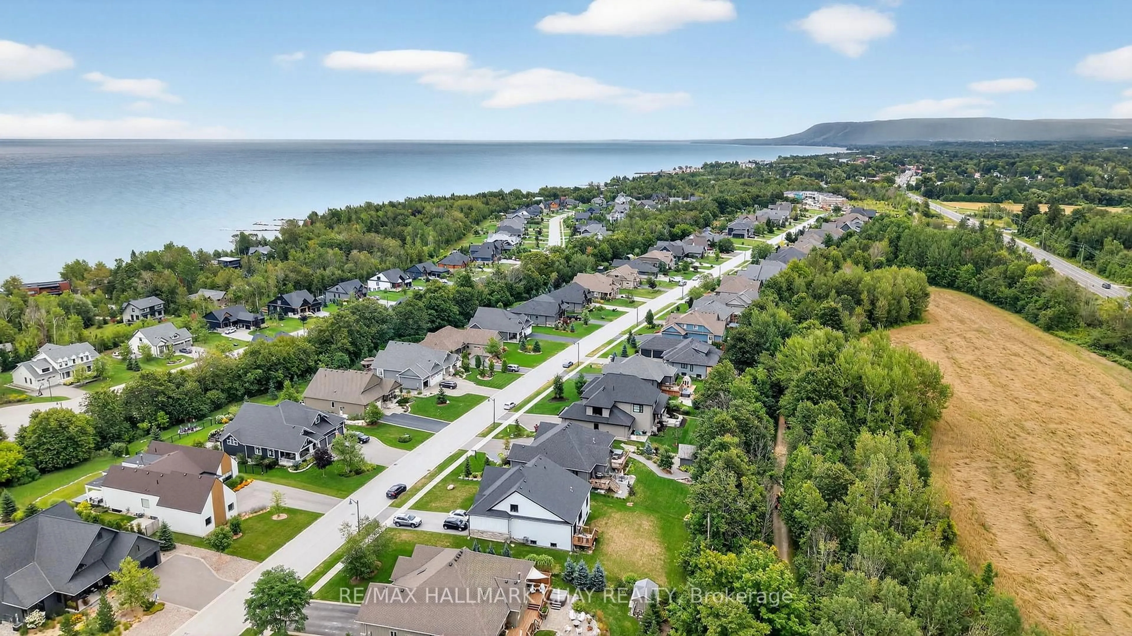 A pic from outside/outdoor area/front of a property/back of a property/a pic from drone, water/lake/river/ocean view for 127 High Bluff Lane, Blue Mountains Ontario N0H 2P0