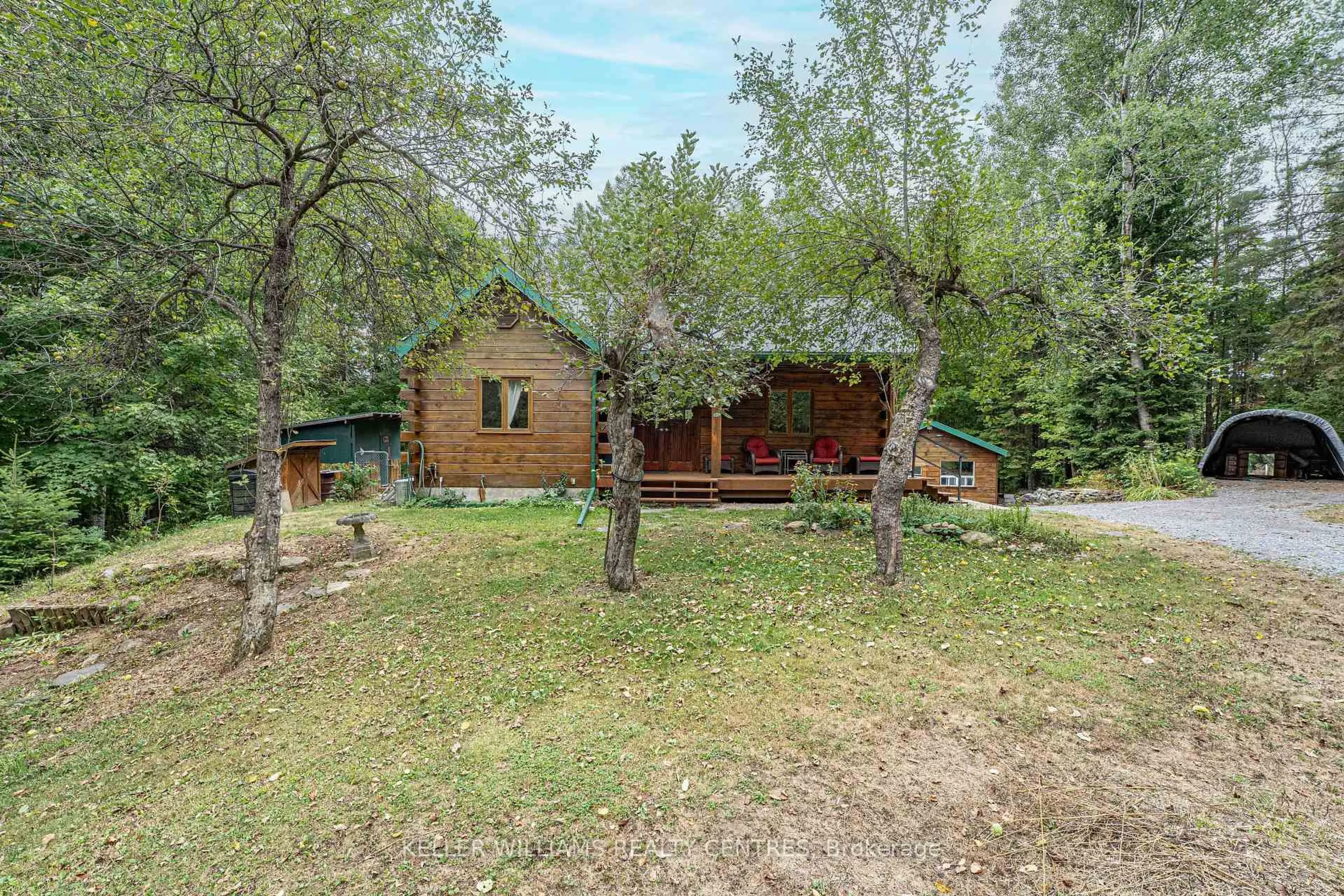 A pic from outside/outdoor area/front of a property/back of a property/a pic from drone, forest/trees view for 3443 County Rd 620 Rd, North Kawartha Ontario K0L 1A0