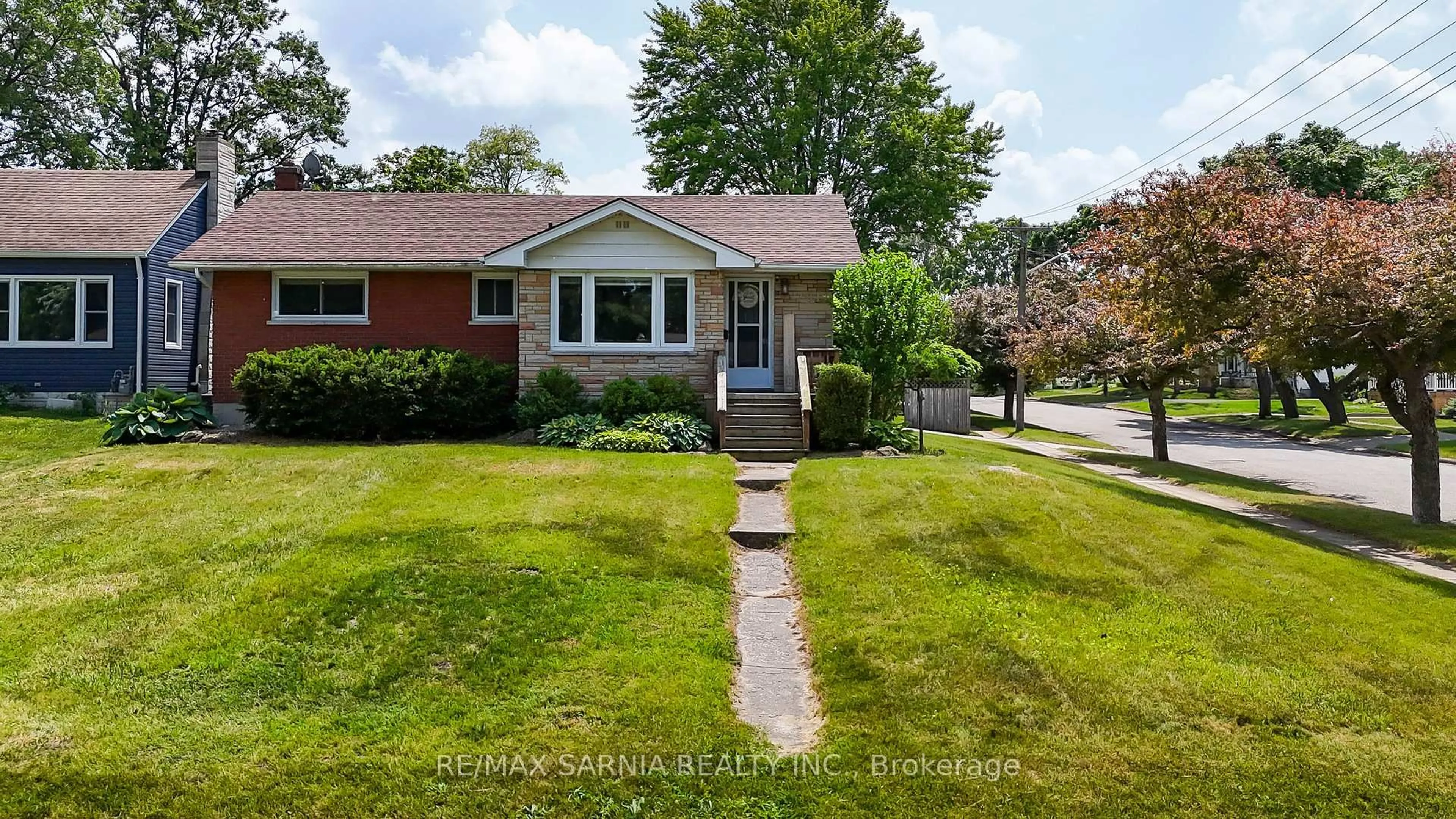 Home with brick exterior material, street for 701 Hall St, Sarnia Ontario N7V 2C4