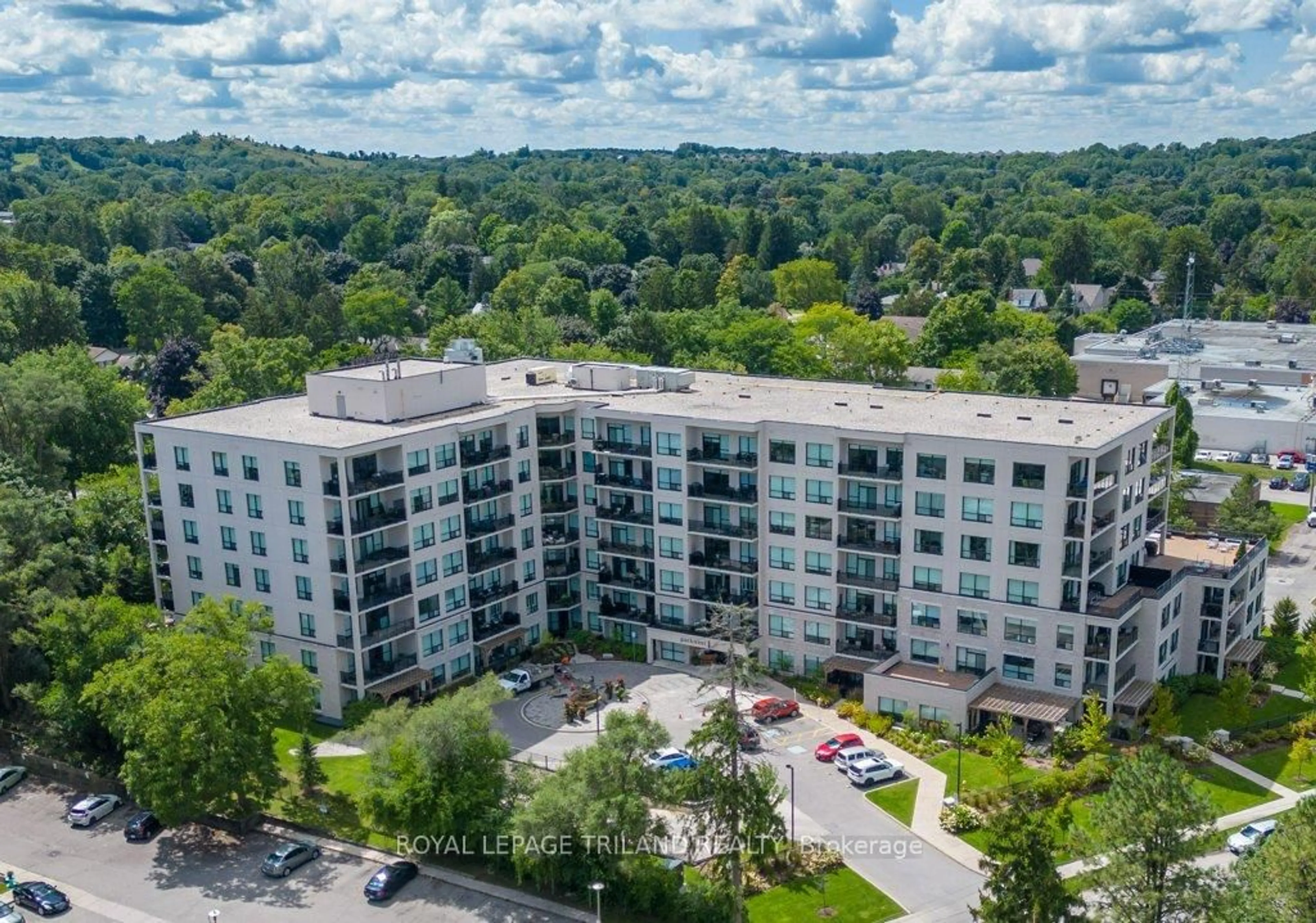A pic from outside/outdoor area/front of a property/back of a property/a pic from drone, unknown for 1200 Commissioners Rd #504, London South Ontario N6K 1C7