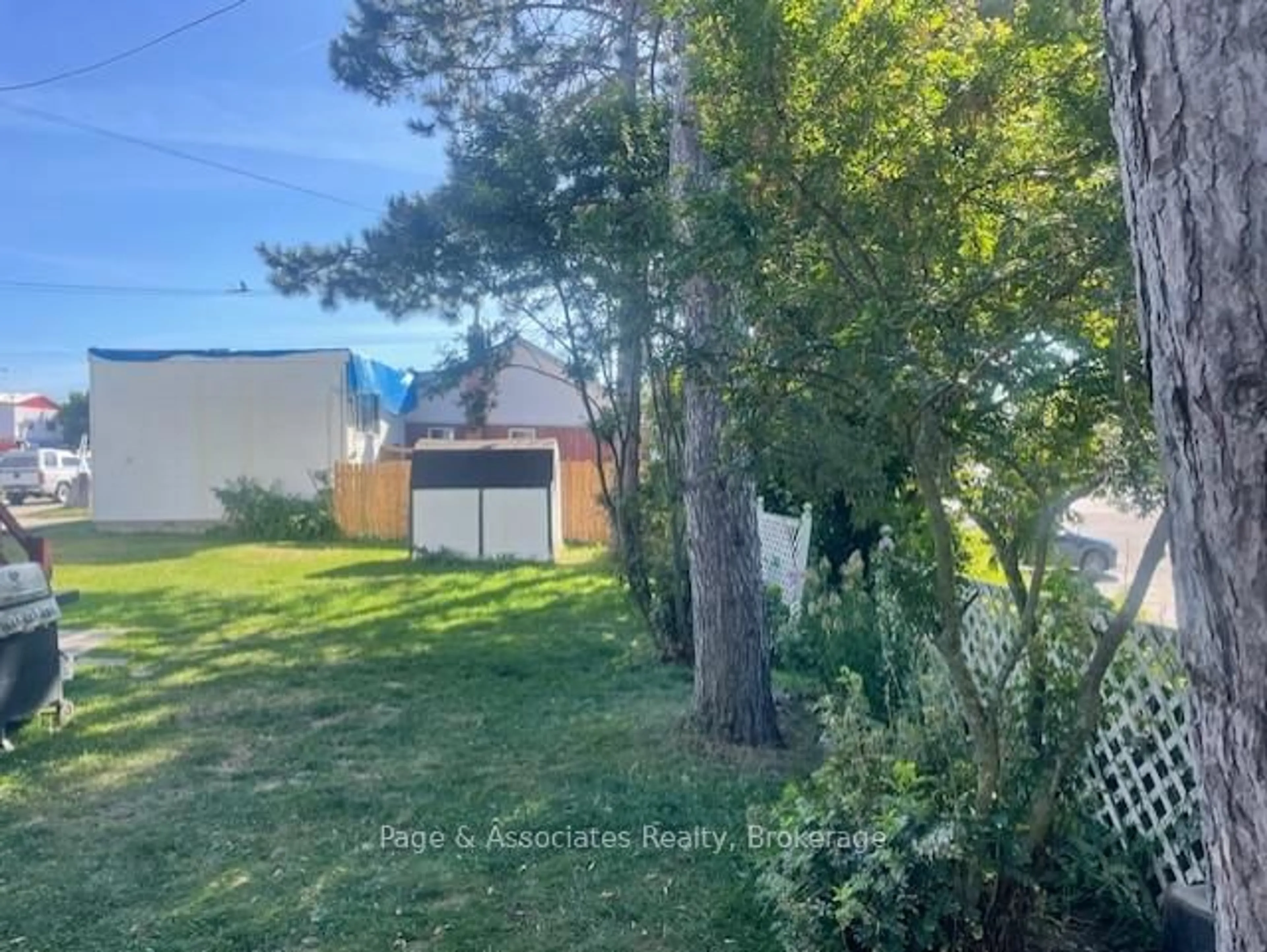 A pic from outside/outdoor area/front of a property/back of a property/a pic from drone, forest/trees view for 28 William St, West Nipissing Ontario P2B 2A3