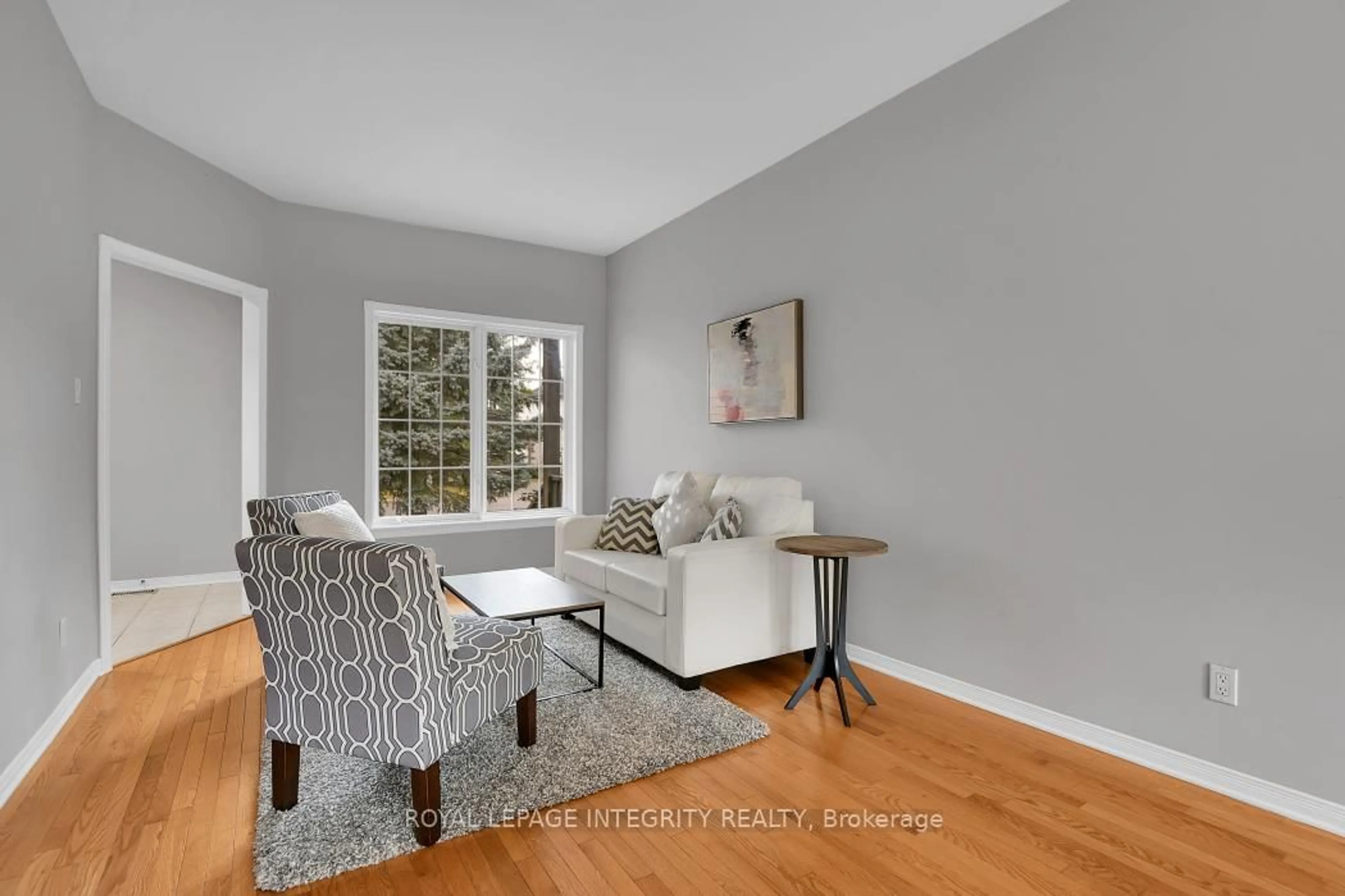 Living room with furniture, wood/laminate floor for 1036 Rocky Harbour Cres, Ottawa Ontario K1V 1V2