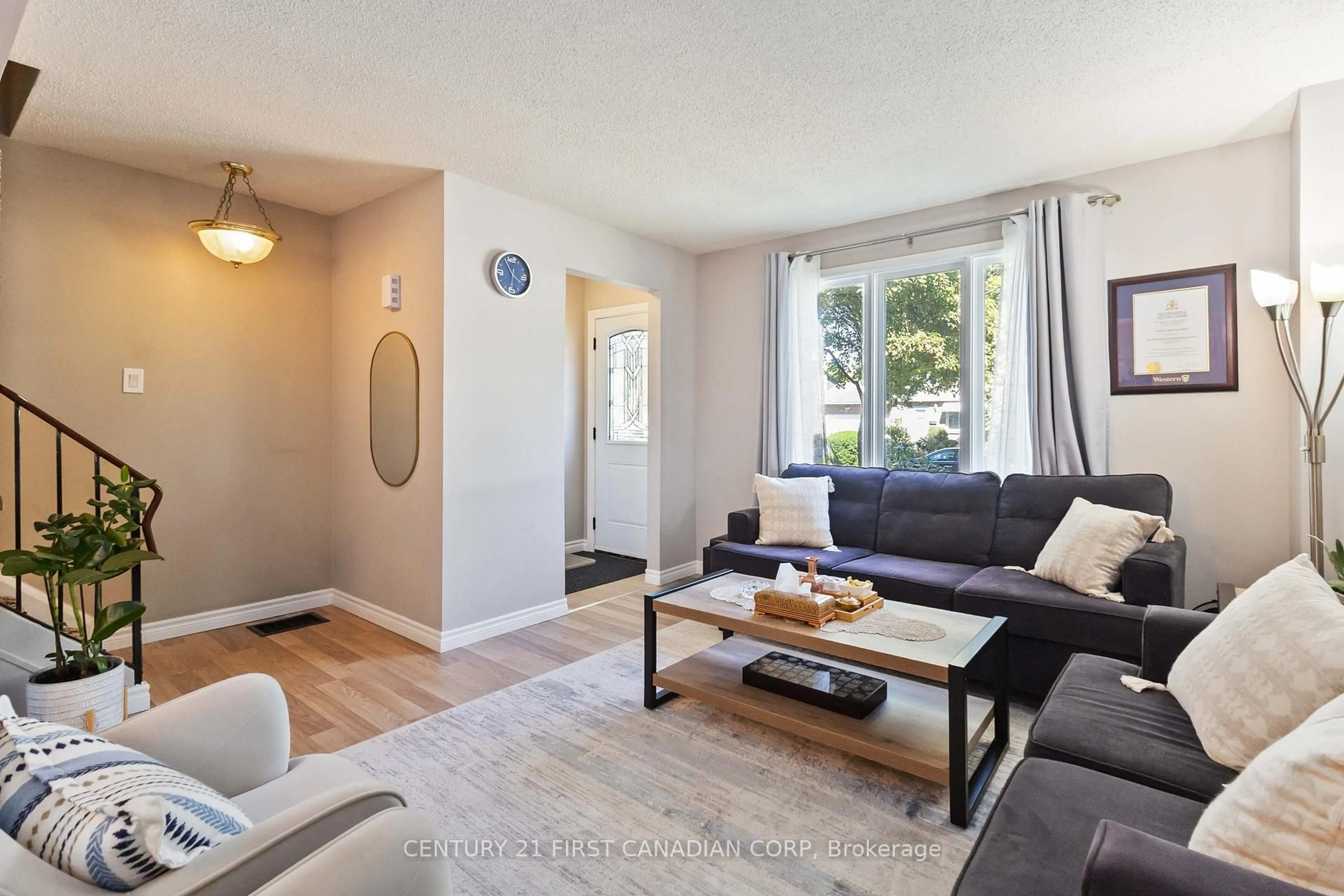 Living room with furniture, wood/laminate floor for 37 Elvira Cres, London South Ontario N6E 2N1
