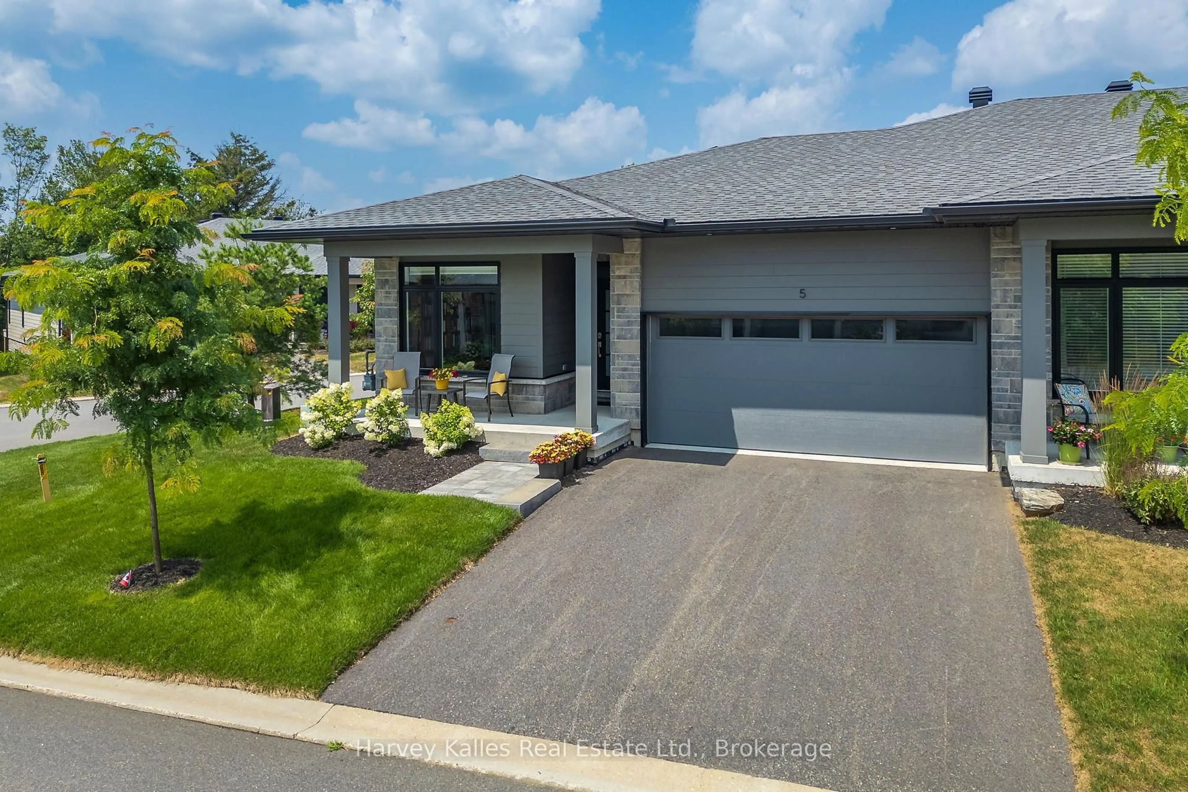 Home with vinyl exterior material, street for 5 Blue Birch Lane, Huntsville Ontario P1H 0G4