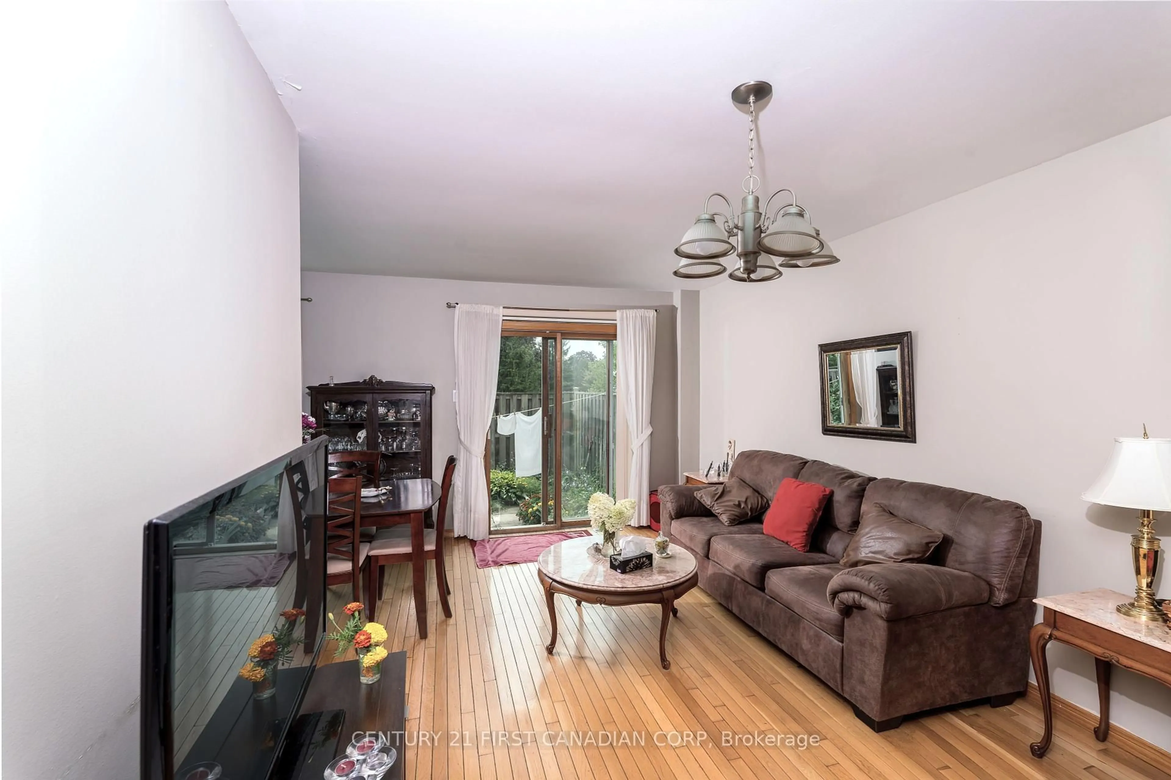 Living room with furniture, wood/laminate floor for 195 Deveron Cres, London South Ontario N5Z 4J7